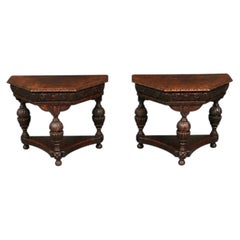Pair of English Jacobean Revival Carved Oak Demilune Console Tables