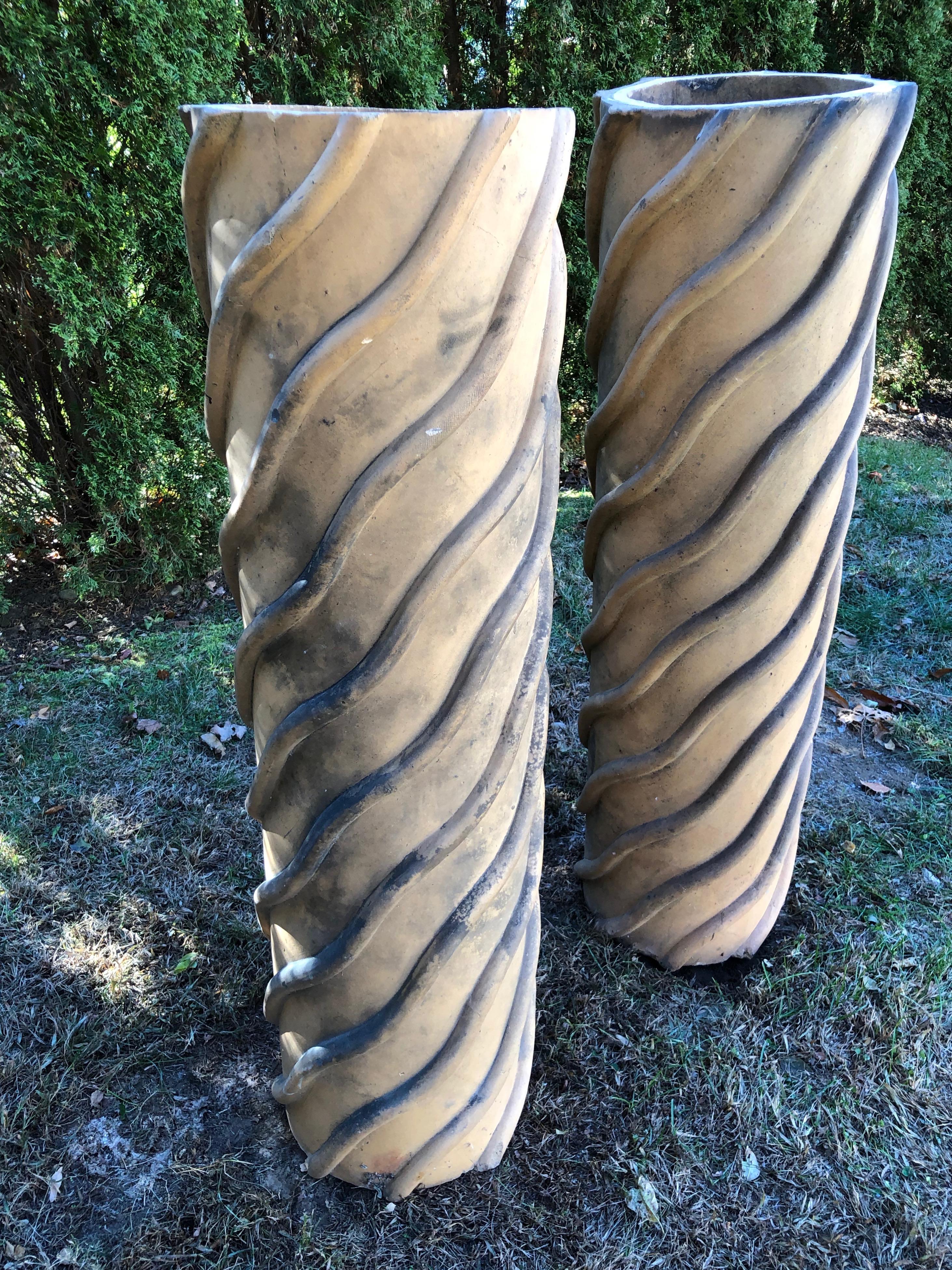 We love these tall hand-made biscuit terracotta chimney pots for their rare sinuous barley-twist design with traces of coal dust on the surface, and their warm, creamy color. They are perfectly matched in height and levelness, although some of the