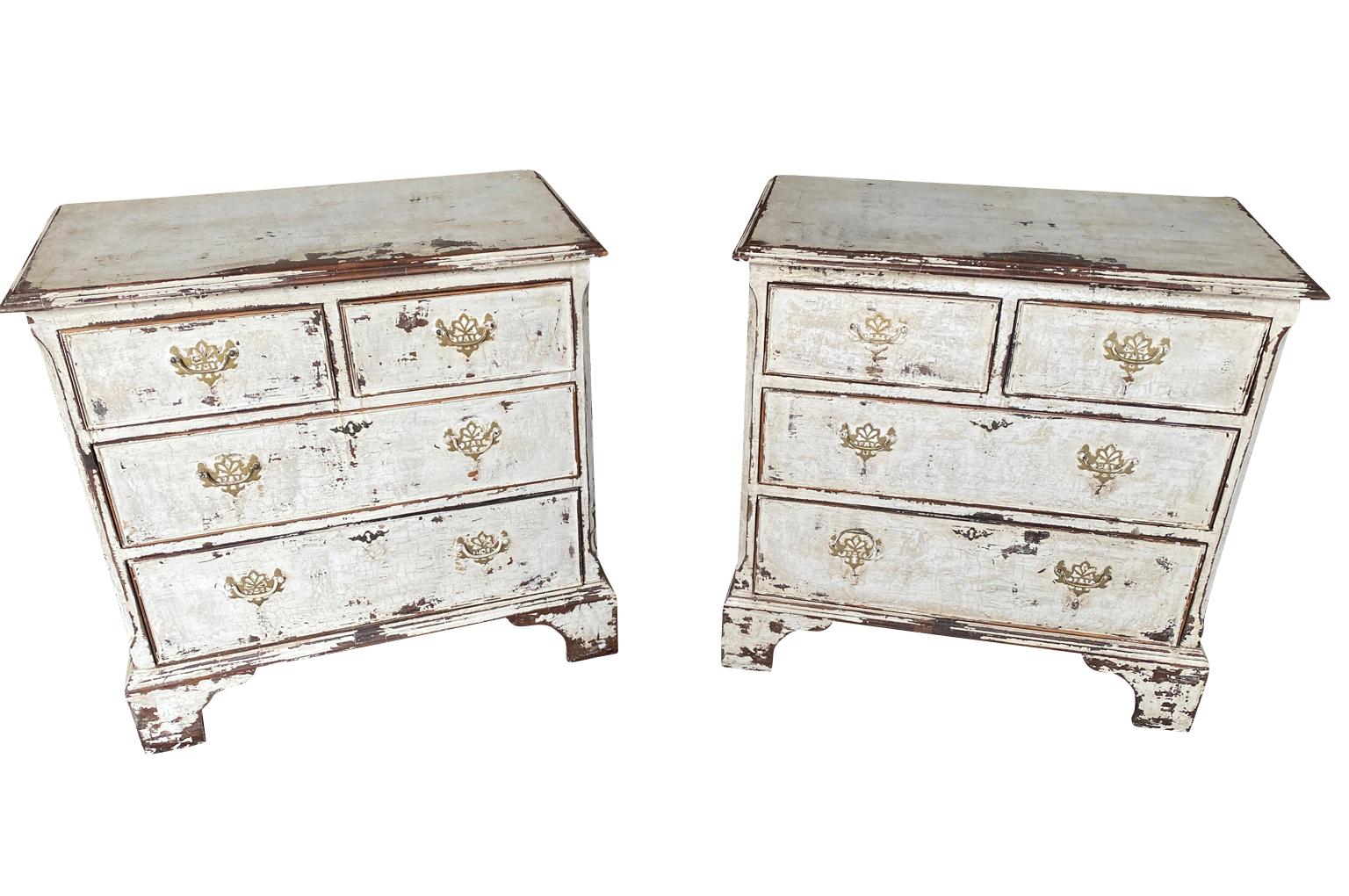 A lovely pair of later 19th century English Side Chests.  Beautifully constructed from painted wood each with 2 short drawers and 2 long drawers raised on bracket feet.  Perfect as bedside cabinets.