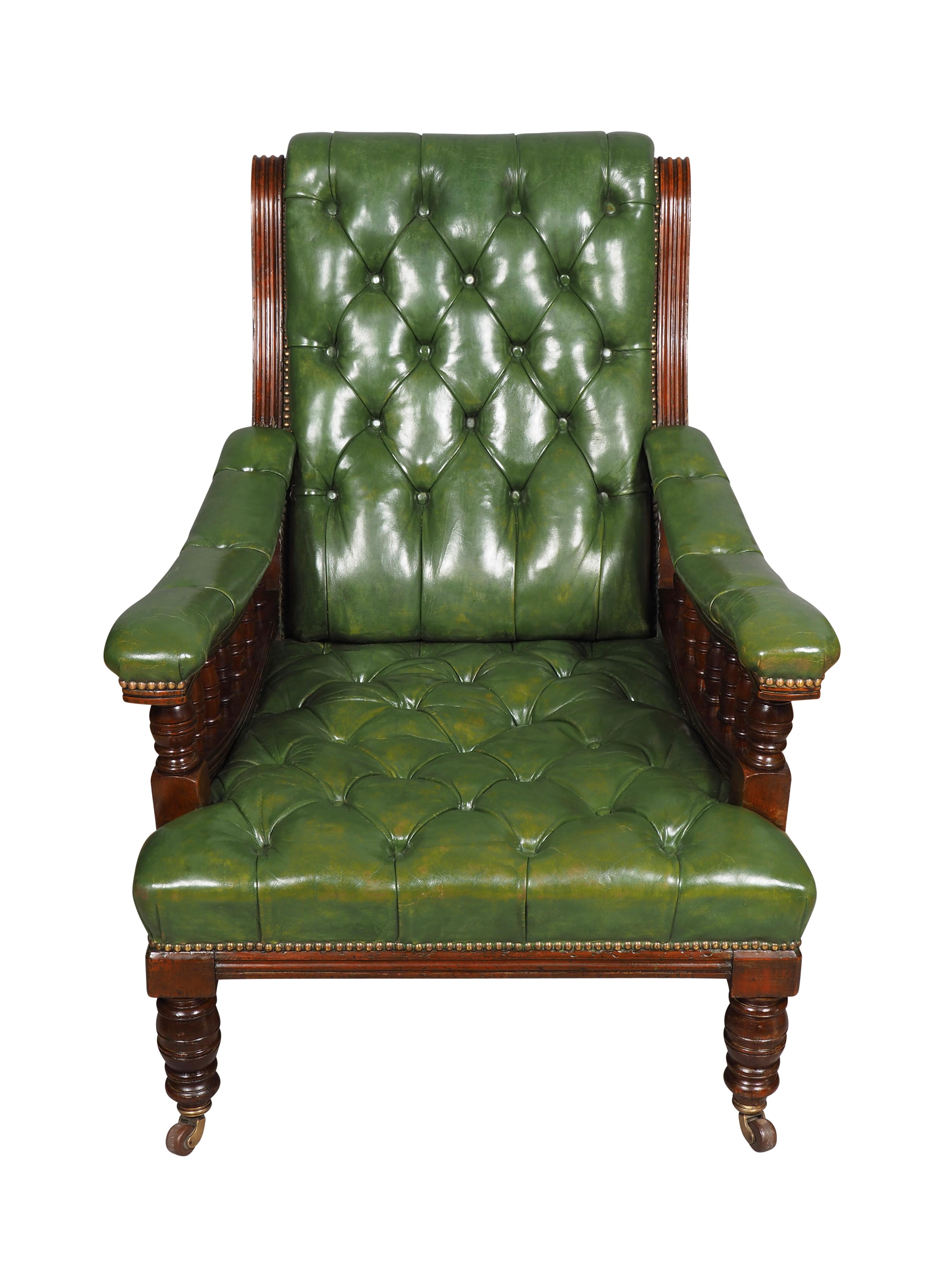 Each large scale with green tufted backs and seats with brass tacks. Down swept padded arms with spindle supports. Turned legs with casters. Estate of  Bartlett Burnap. Palm Beach. 
Seat Depth 23.5