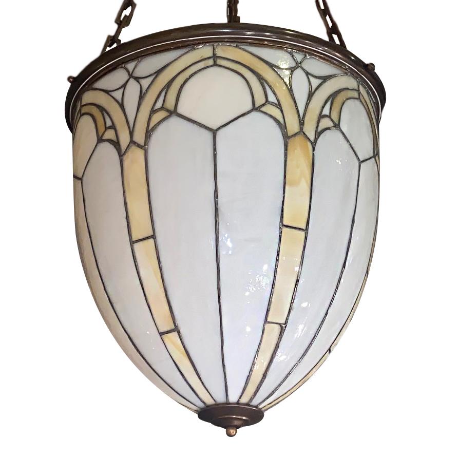 A pair of circa 1920s English neoclassic style leaded glass lanterns with 6 interior candelabra              lights each.  

Measurements:
Present drop 33