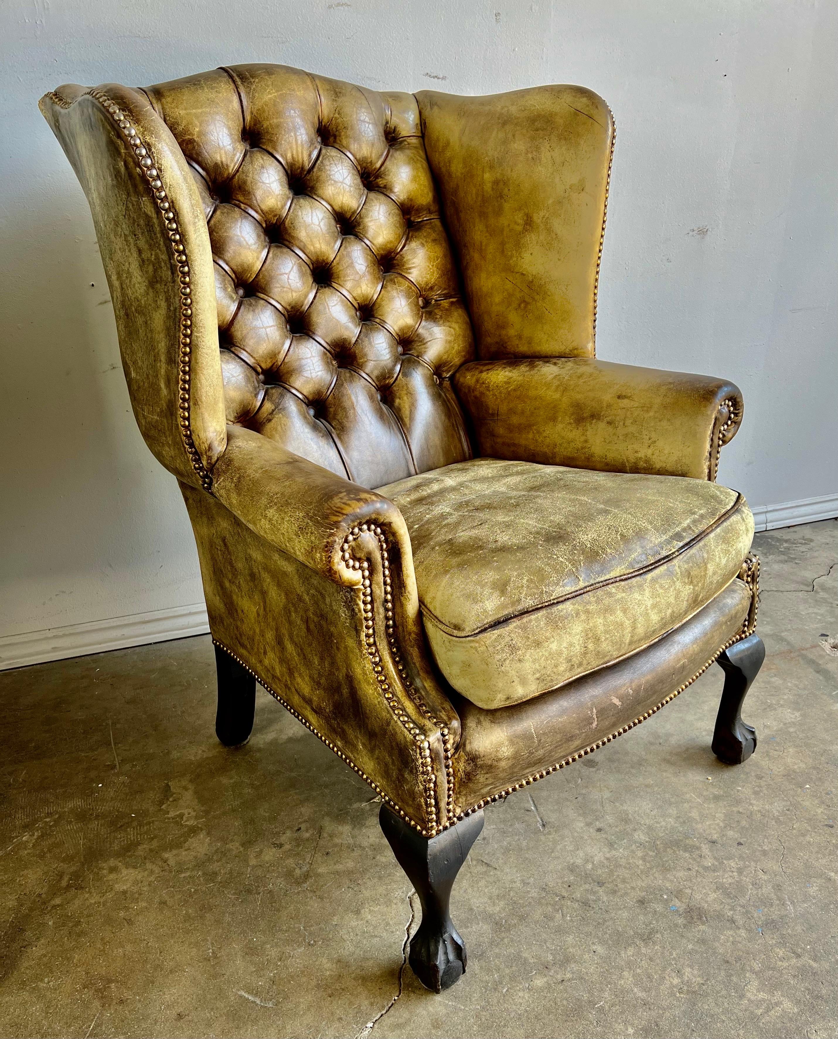 Early 20th Century Pair of English Leather Tufted Wingback Armchairs C. 1900's