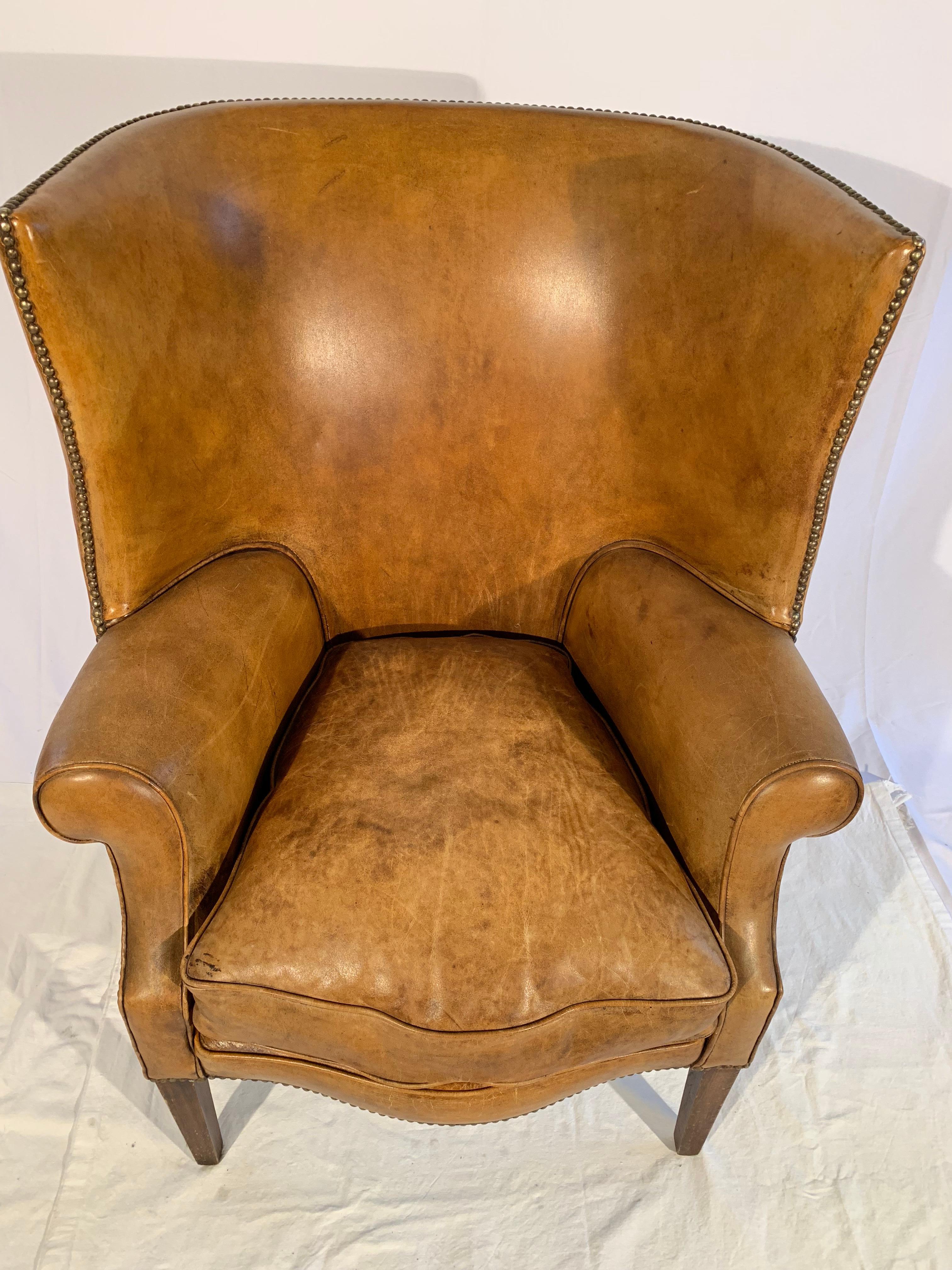 A wonderful pair leather wingback chairs brought over from England 50 years ago.
Cushions were recently filled with feather. Leather is nicely worn, yet no damage at all.
A very unique curved open back with a mustache front to cushion.
Measures: