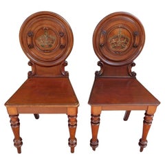 Antique Pair of English Mahogany Crown Medallion Hall Chairs with Turned Legs, C. 1840