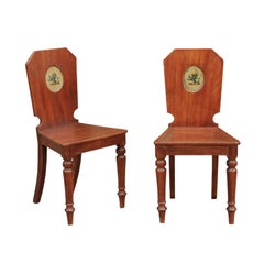 Pair of English Mahogany Hall Chairs with Heraldic Lion Motifs, circa 1870