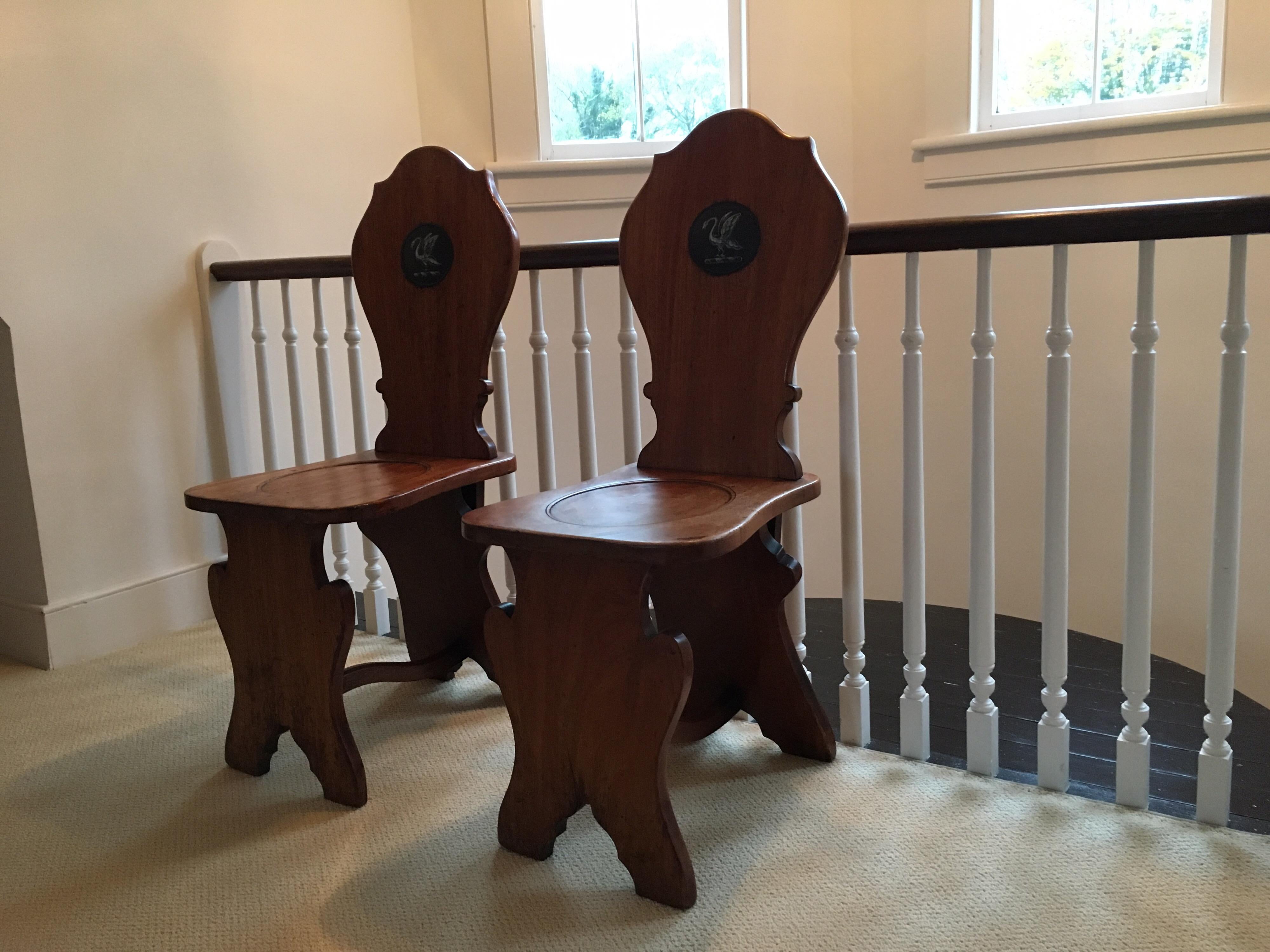 Pair of English Mahogany Hall Chairs with Heraldic Swan Motifs In Good Condition In Southampton, NY
