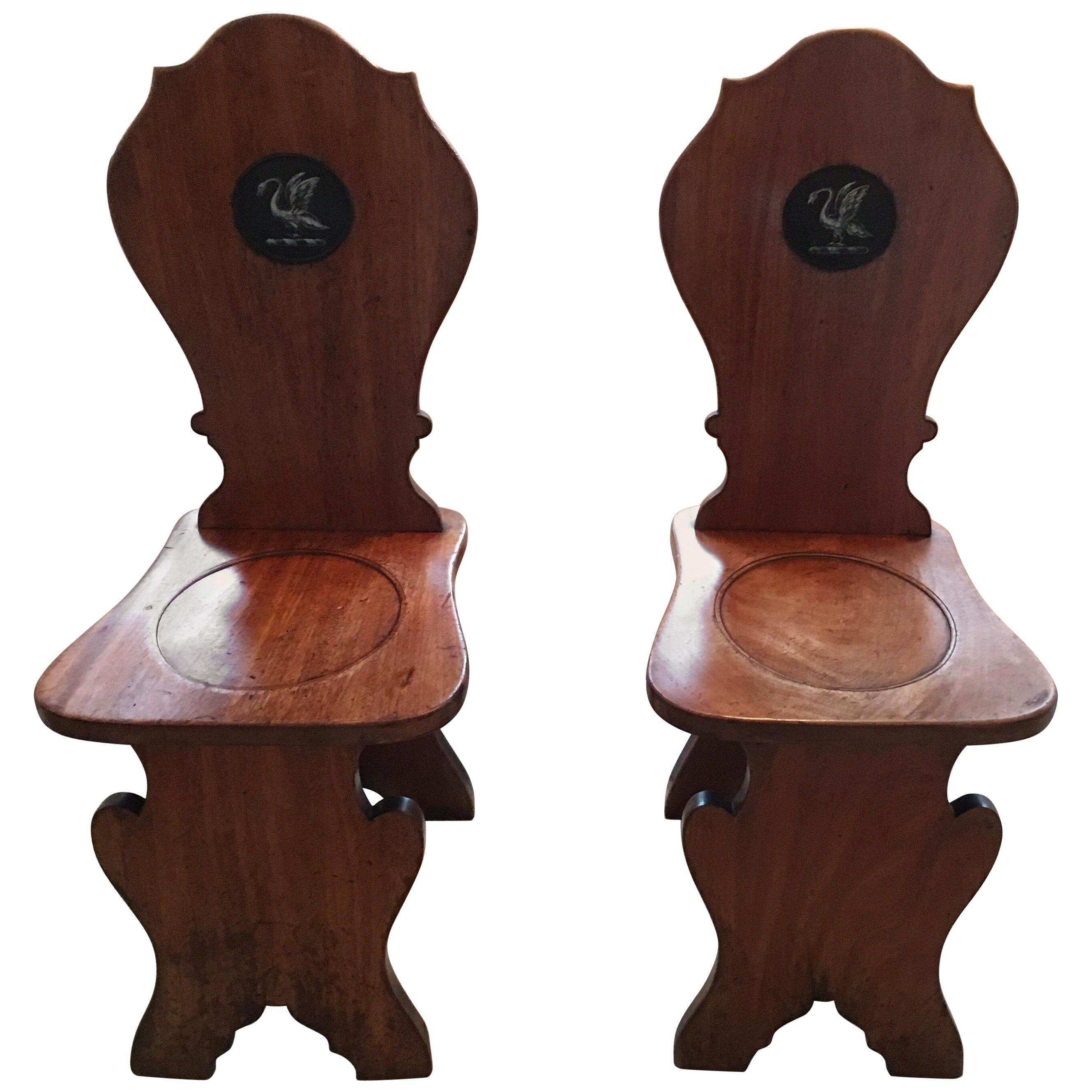 Pair of English Mahogany Hall Chairs with Heraldic Swan Motifs