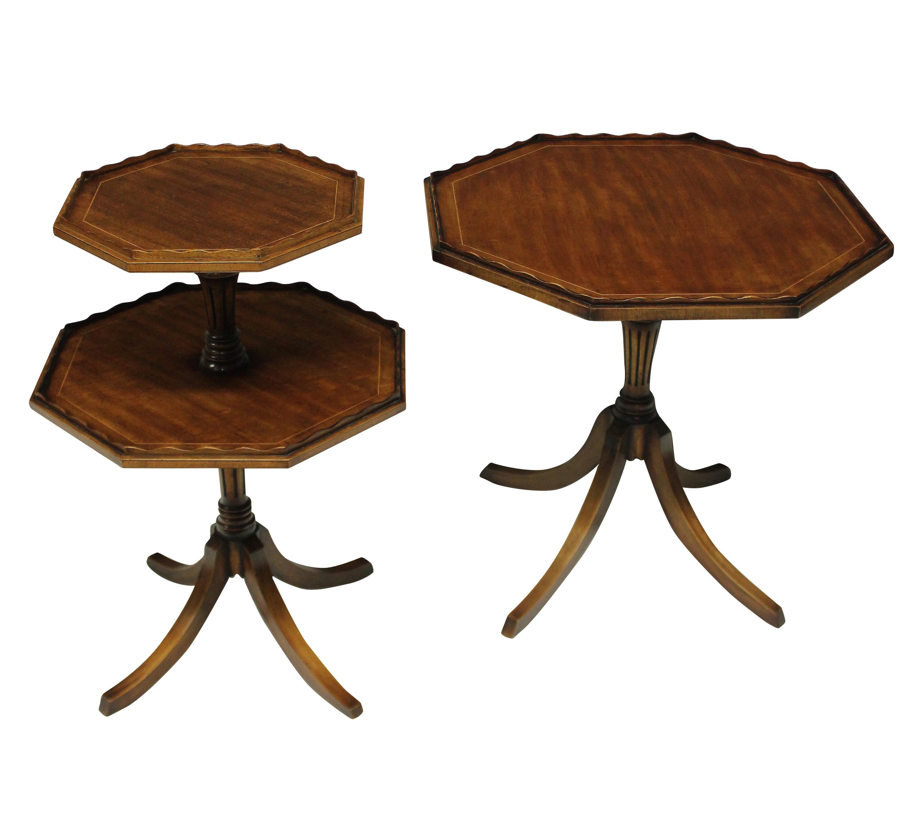 A pair of English mahogany side tables with good patina, each with an octagonal top with pie crust edge. One table with a tilt-top and the other with two tiers, both with box wood stringing.
Measures: 56cm high x 60 diameter (tilt-top) x 68cm high