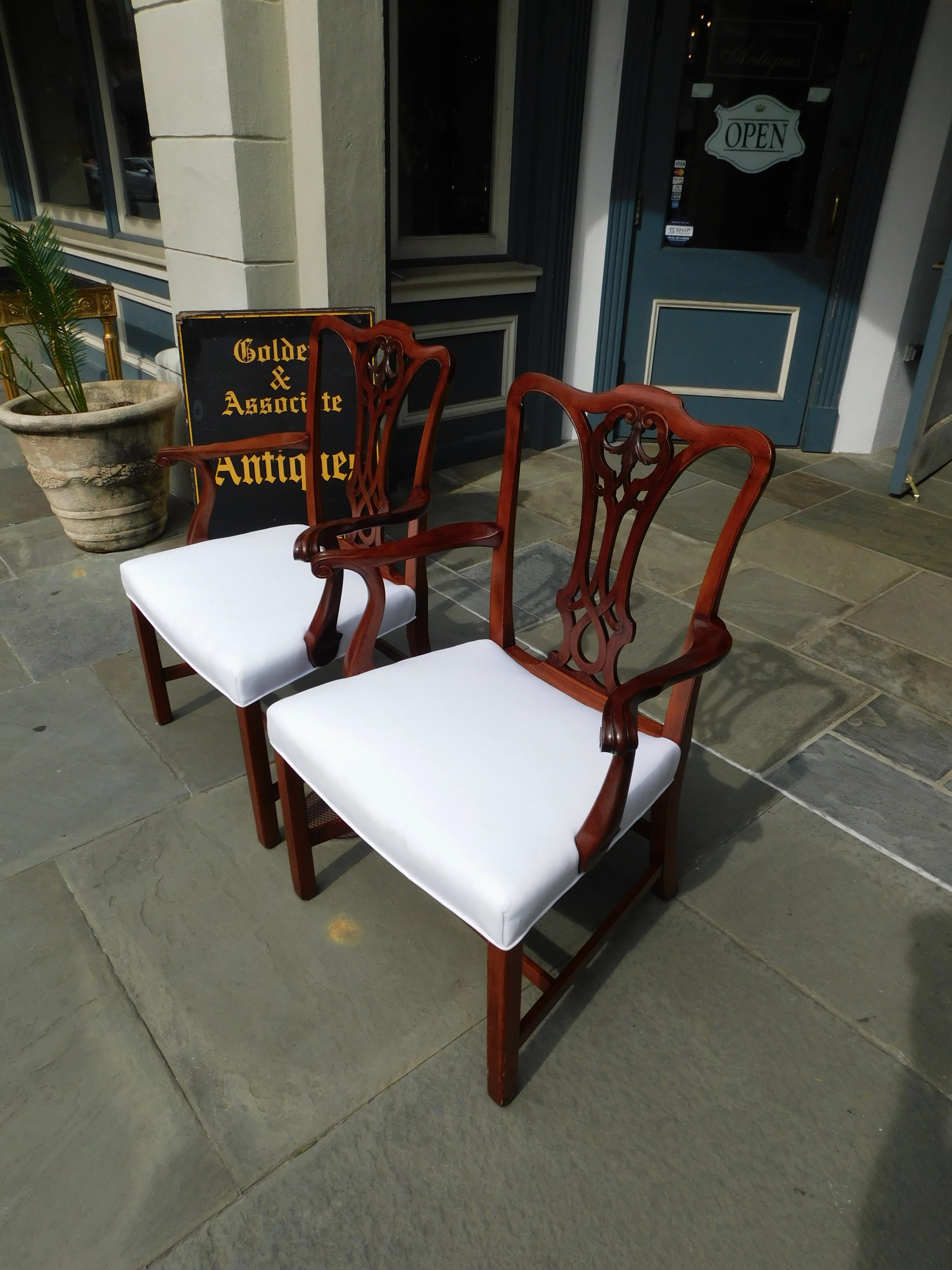 Hand-Carved Pair of English Mahogany Serpentine Crest Arm Chairs with Saddle Seats, C. 1820 For Sale