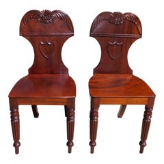 Pair of English Mahogany Shield Back Foliage Crest Hall Chairs, Circa 1820