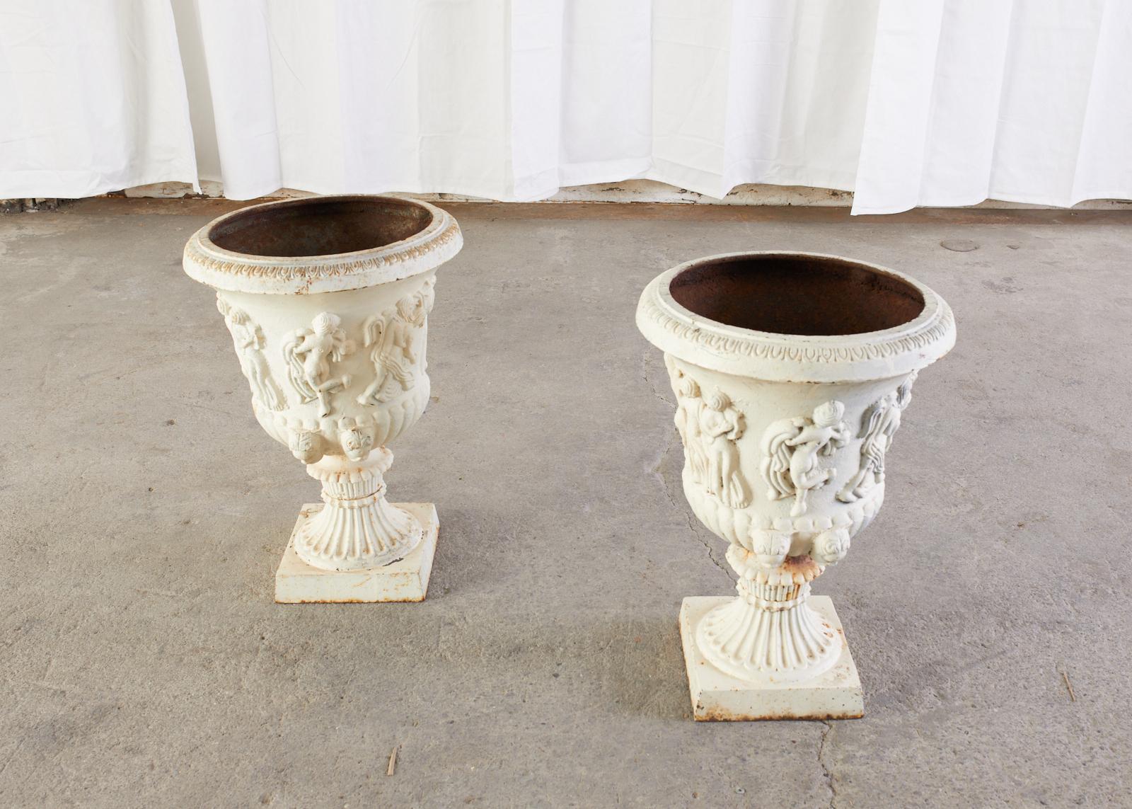 Cast Pair of English Neoclassical Style Iron Garden Urns For Sale