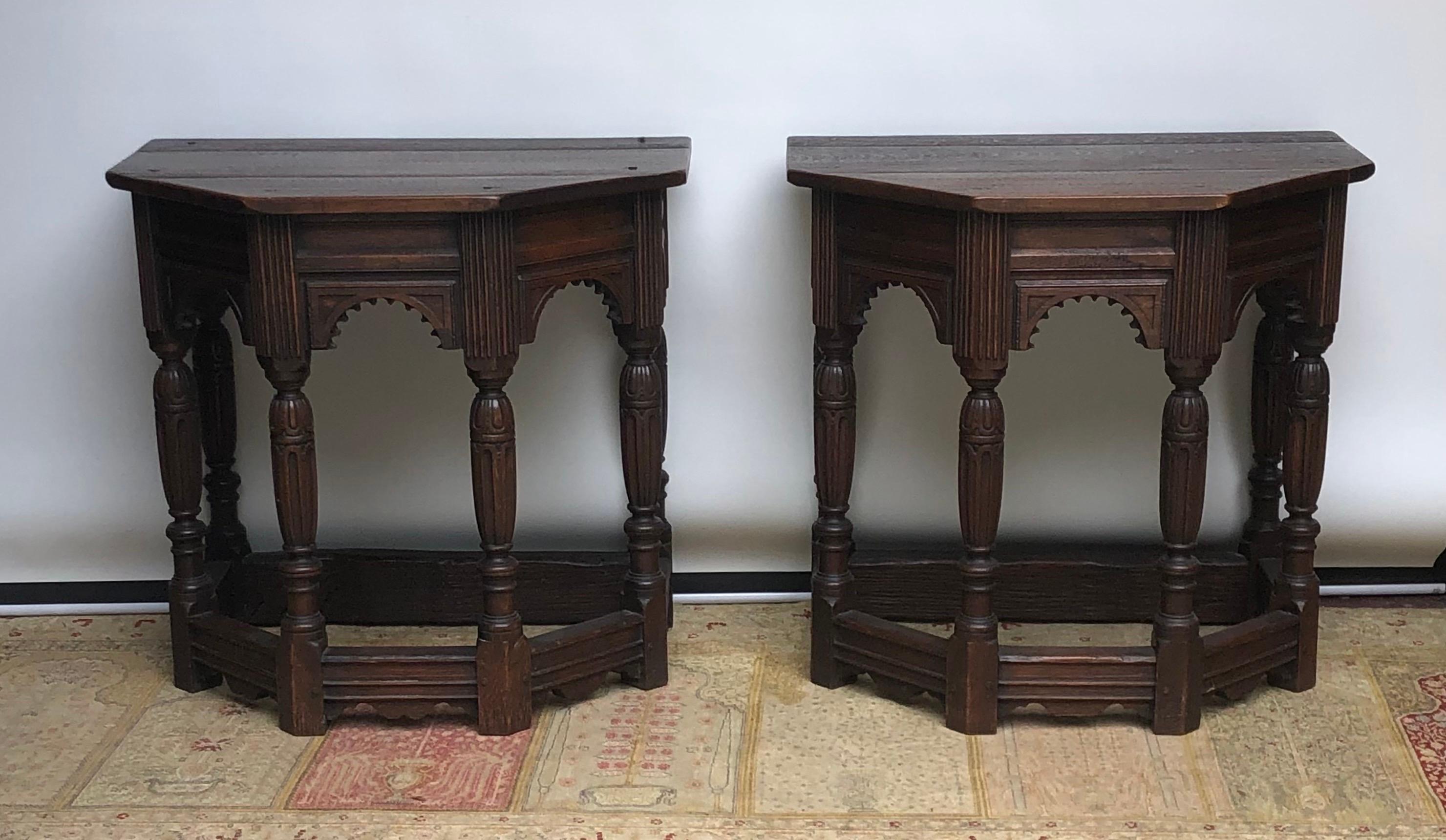 This Pair of English solid Oak Elizabethan Style Console / Side Tables are Renaissance Revival Period. The Elizabethan Style Console Tables have one inch thick solid oak plank tops attached with handmade rose-head nails. The Renaissance Revival oak