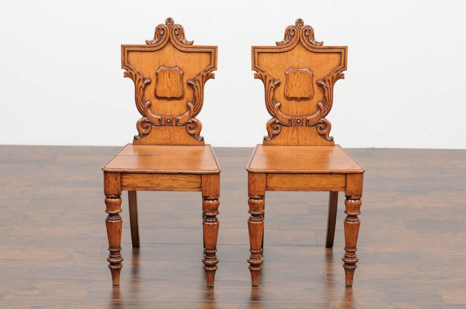 Pair of English Oak Hall Chairs with Carved Shield Backs and Cartouches, 1890s 6