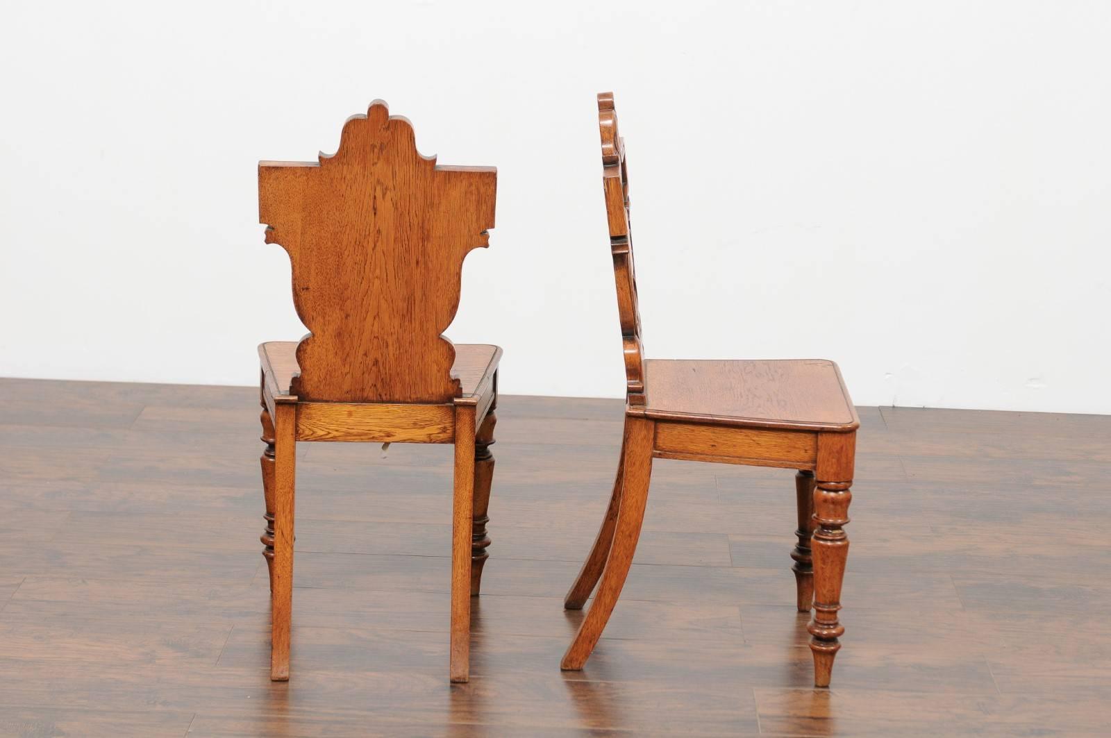 Pair of English Oak Hall Chairs with Carved Shield Backs and Cartouches, 1890s 1