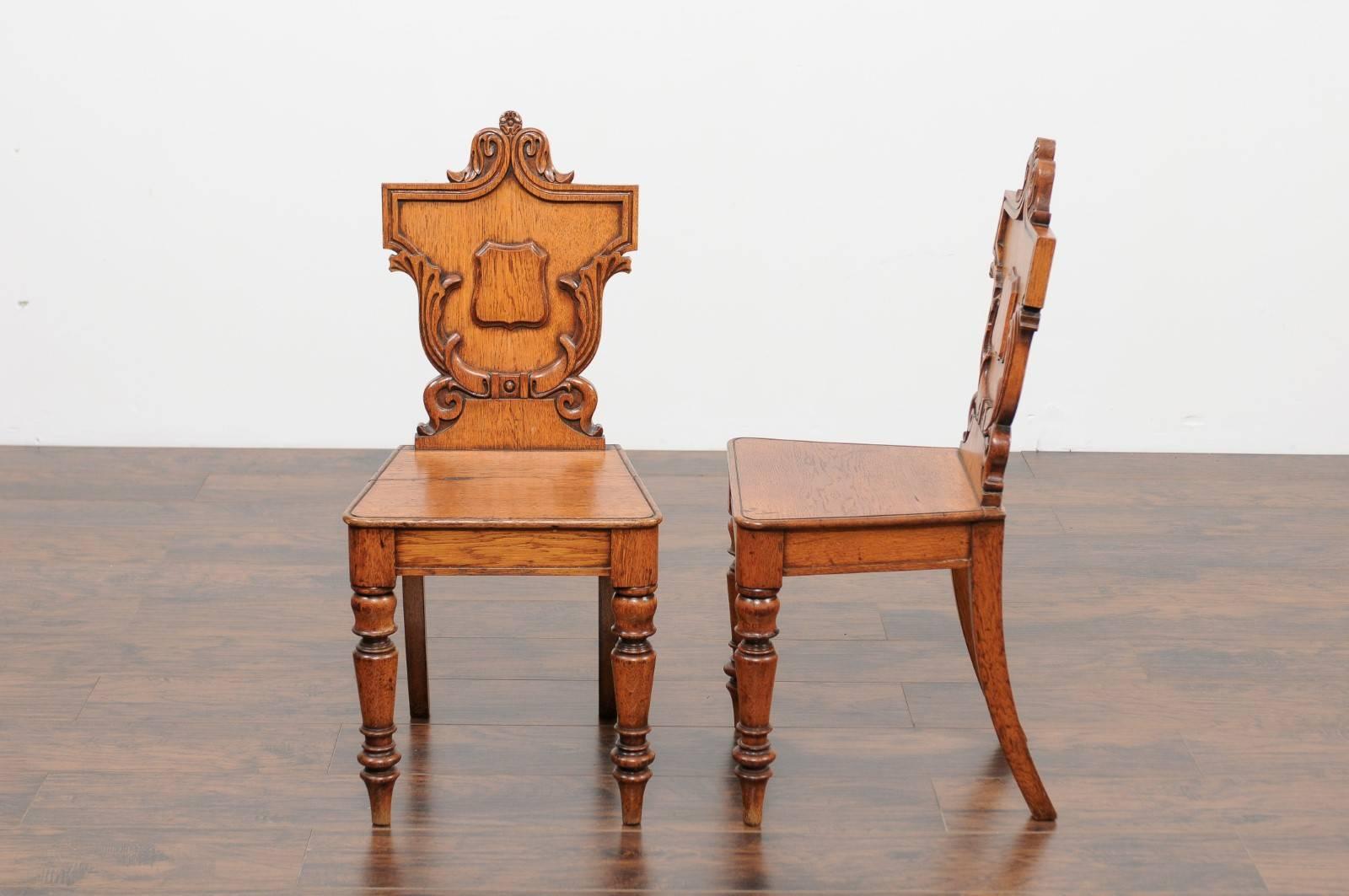 Pair of English Oak Hall Chairs with Carved Shield Backs and Cartouches, 1890s 3