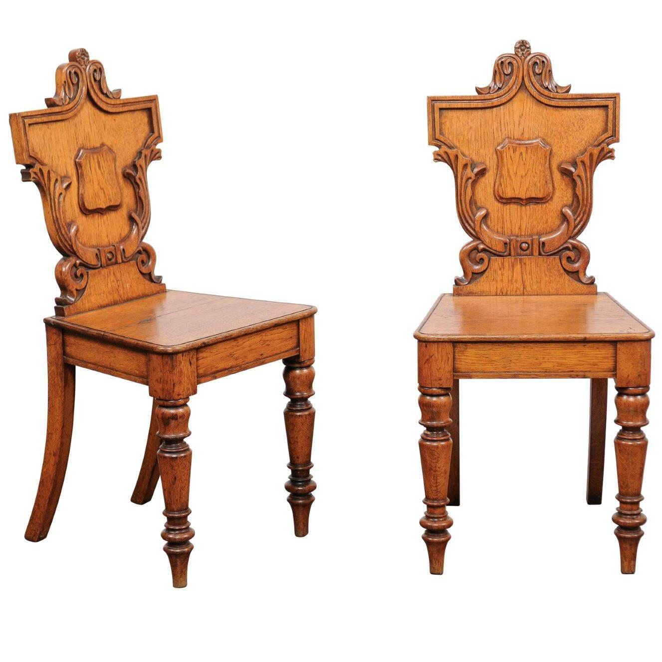 Pair of English Oak Hall Chairs with Carved Shield Backs and Cartouches, 1890s