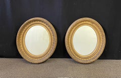 Pair of English Oval Gilt Mirrors