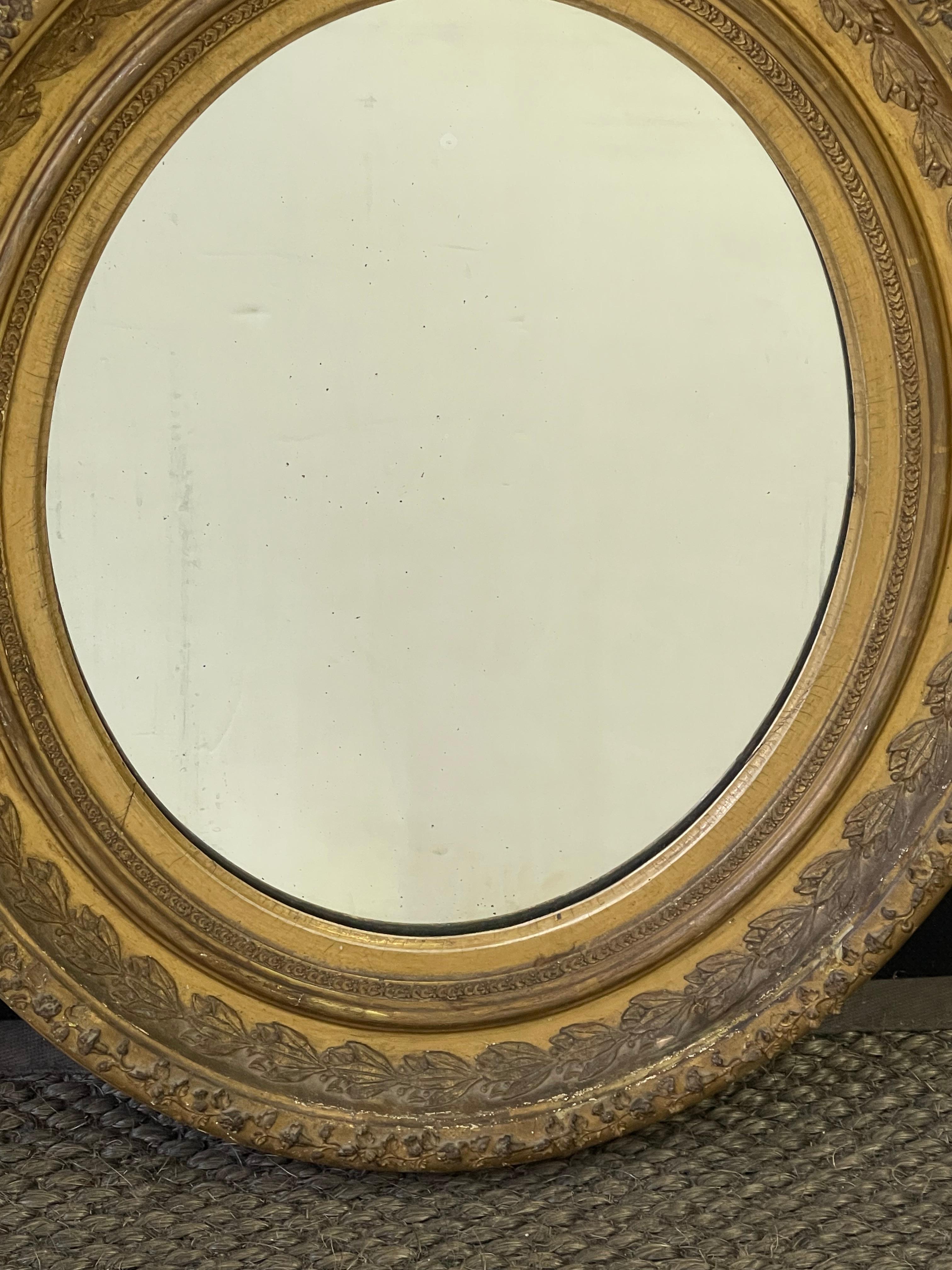 19th Century Pair of English Oval Gilt Mirrors