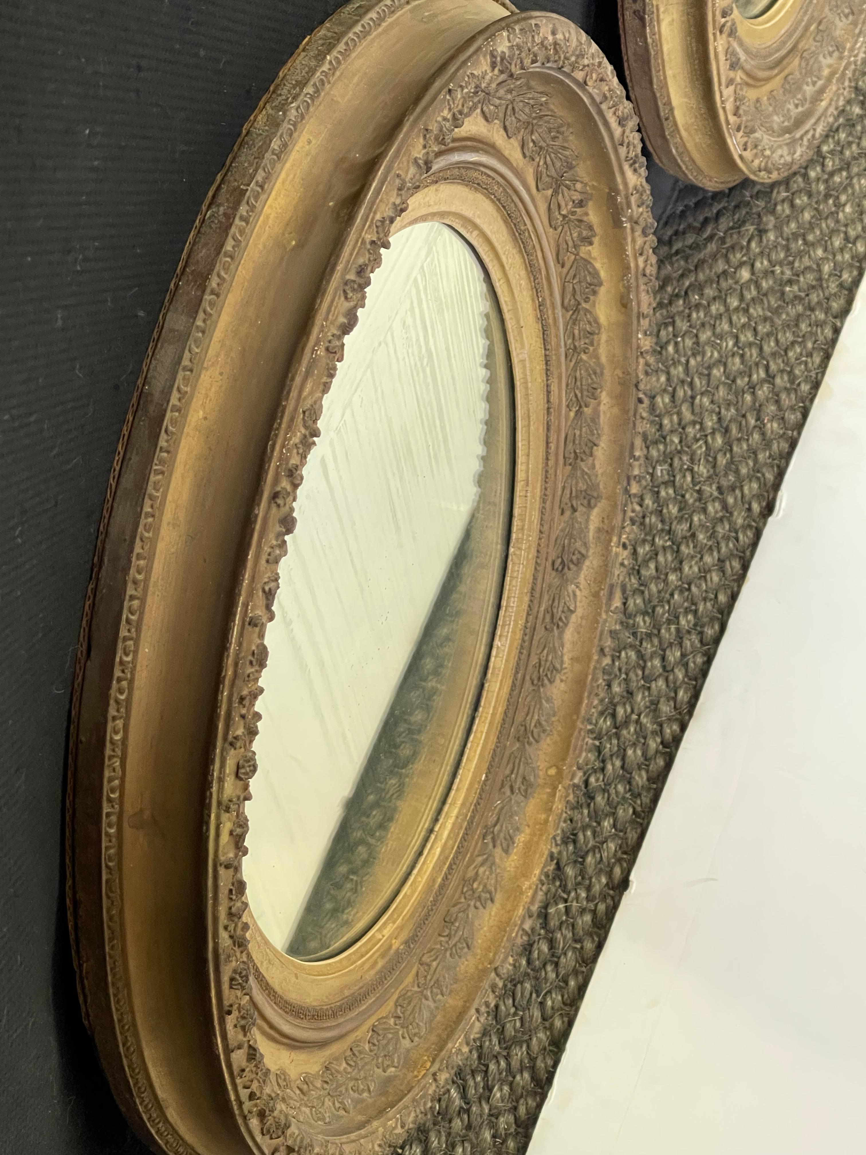 Pair of English Oval Gilt Mirrors 1
