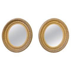 Pair of English Oval Gilt Mirrors
