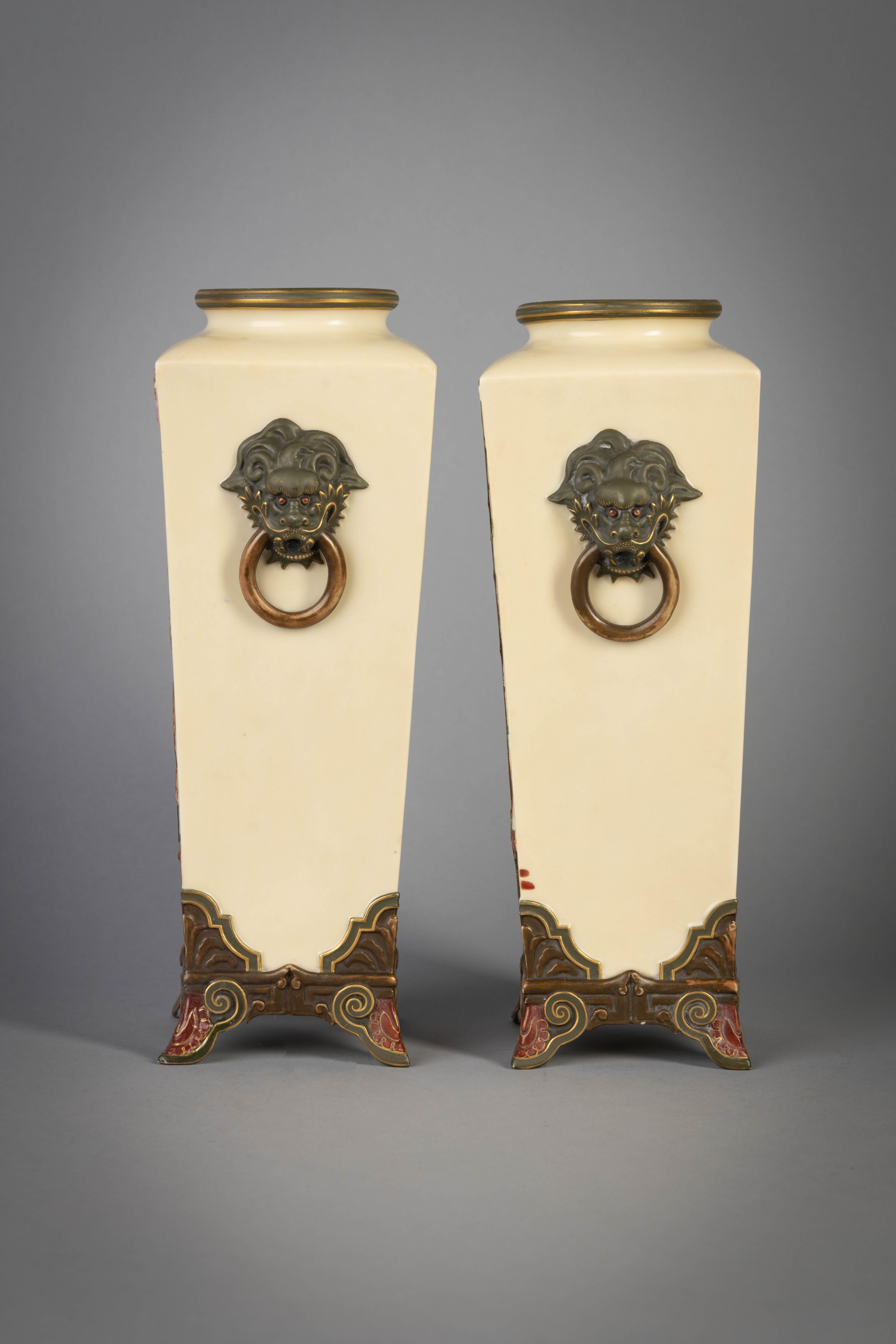 Ivory ground vases with Japanese style faux bronze storks, bamboo and blossoms.