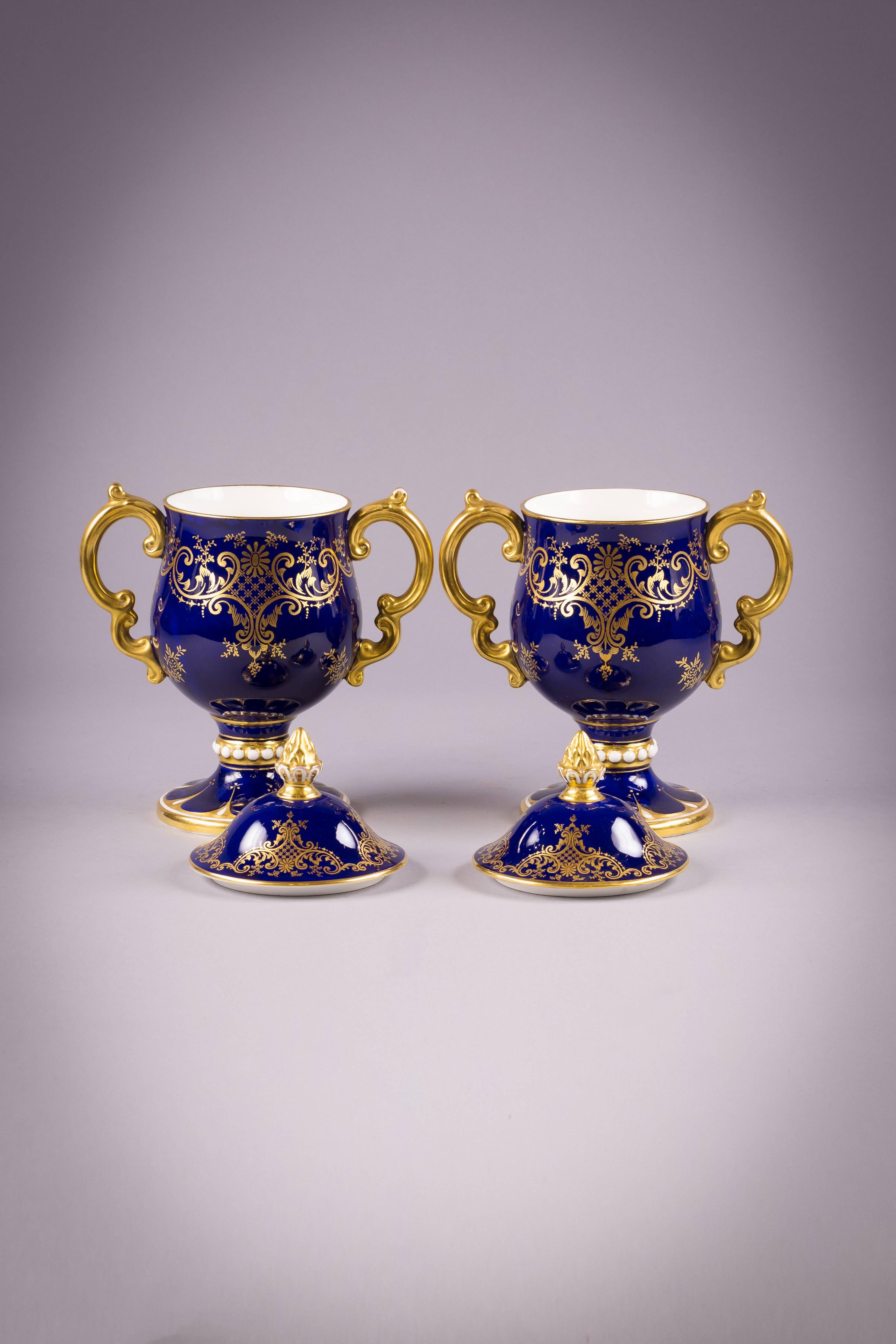 Pair of English porcelain covered loving cups. Coalport mark.