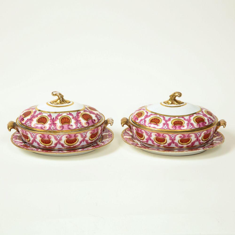 Of oval form with cover and underdish; each boldly painted with a border of iron-red shells and pink foliage.

