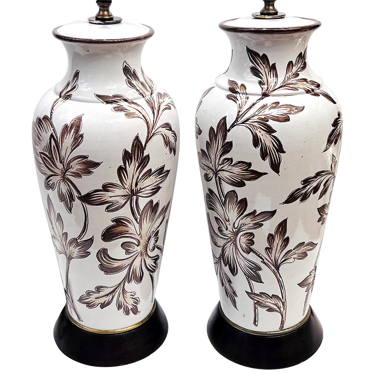 Pair o circa 1950s English porcelain lamps with foliage decoration.

Measurements:
Height of body: 18