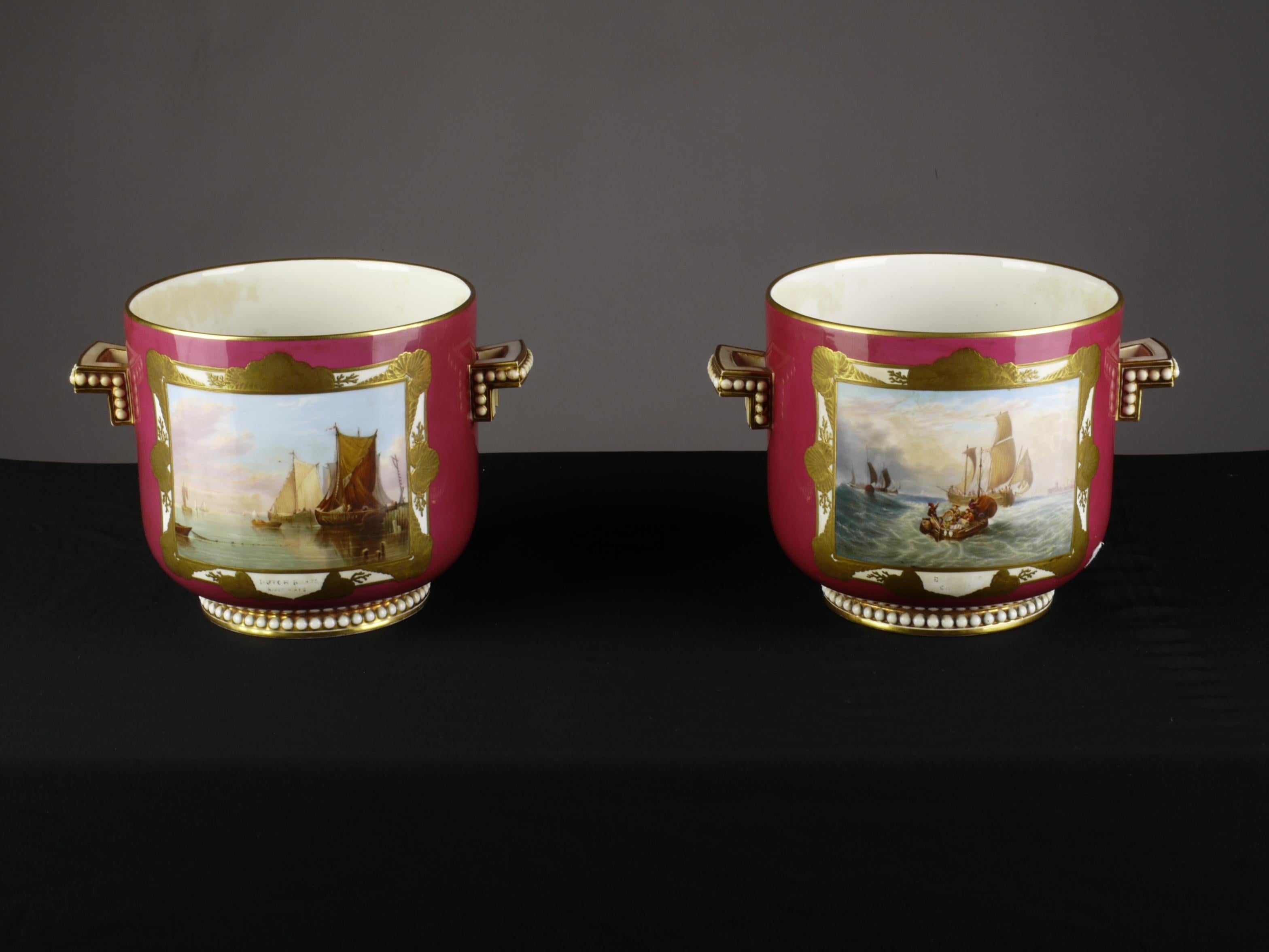 Gilded and painted. The ruby red base color on the round body is provided with two rectangular handles. Represent different views with a trompe l'oeil seashell edged frame. Probably Copeland, indistinct signing 71 in red and 67 printed. Including
