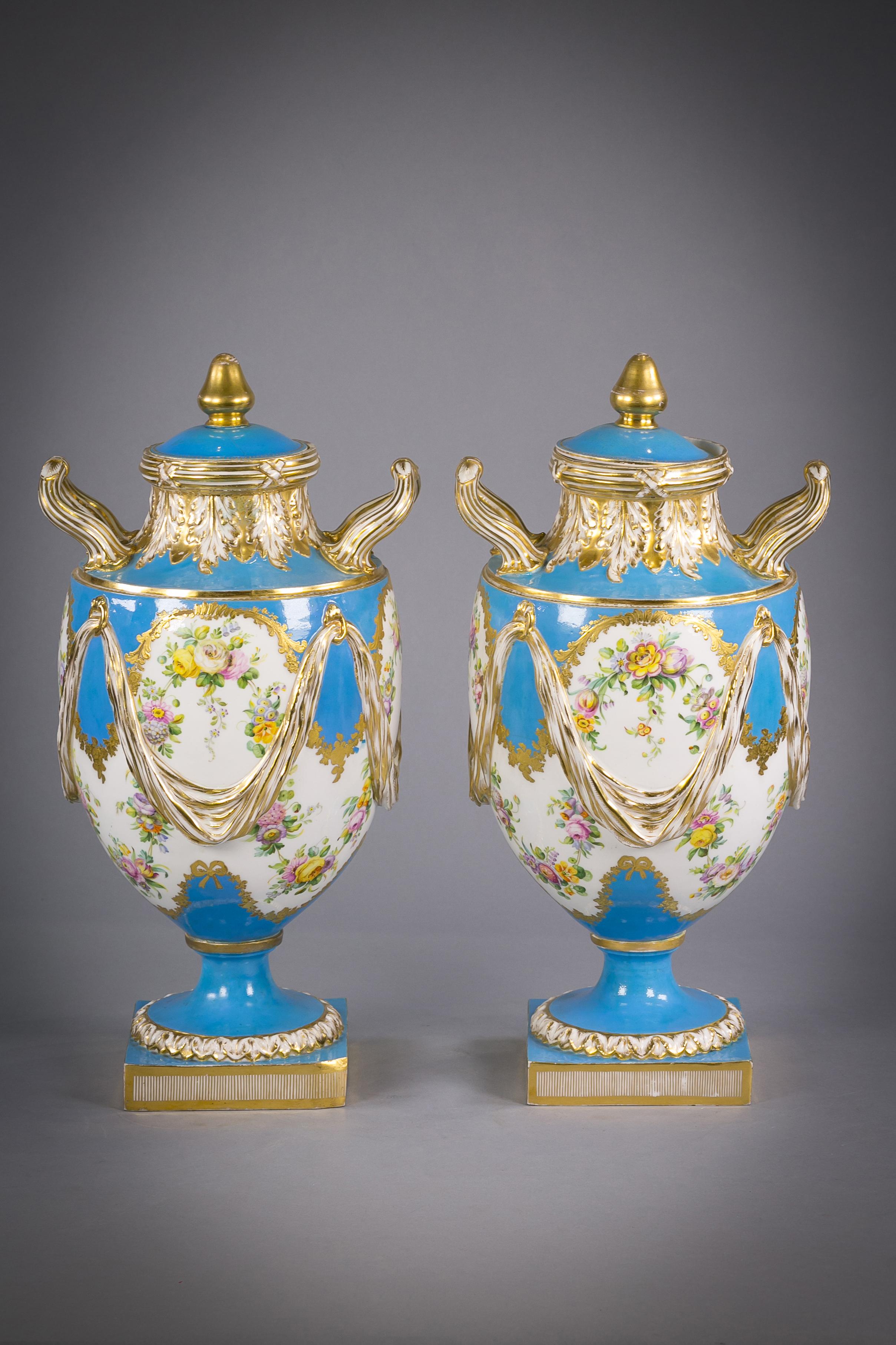 Pair of English porcelain two handled covered vases, Sèvres style, circa 1850.