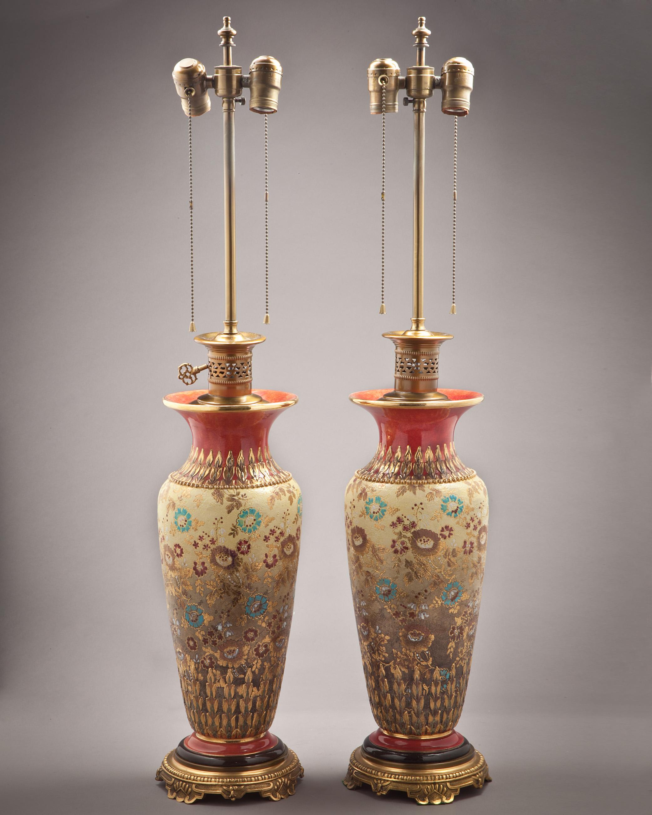 Pair of English porcelain vases mounted as lamps, Doulton Lambeth, circa 1890. Measures: Height to finial 35