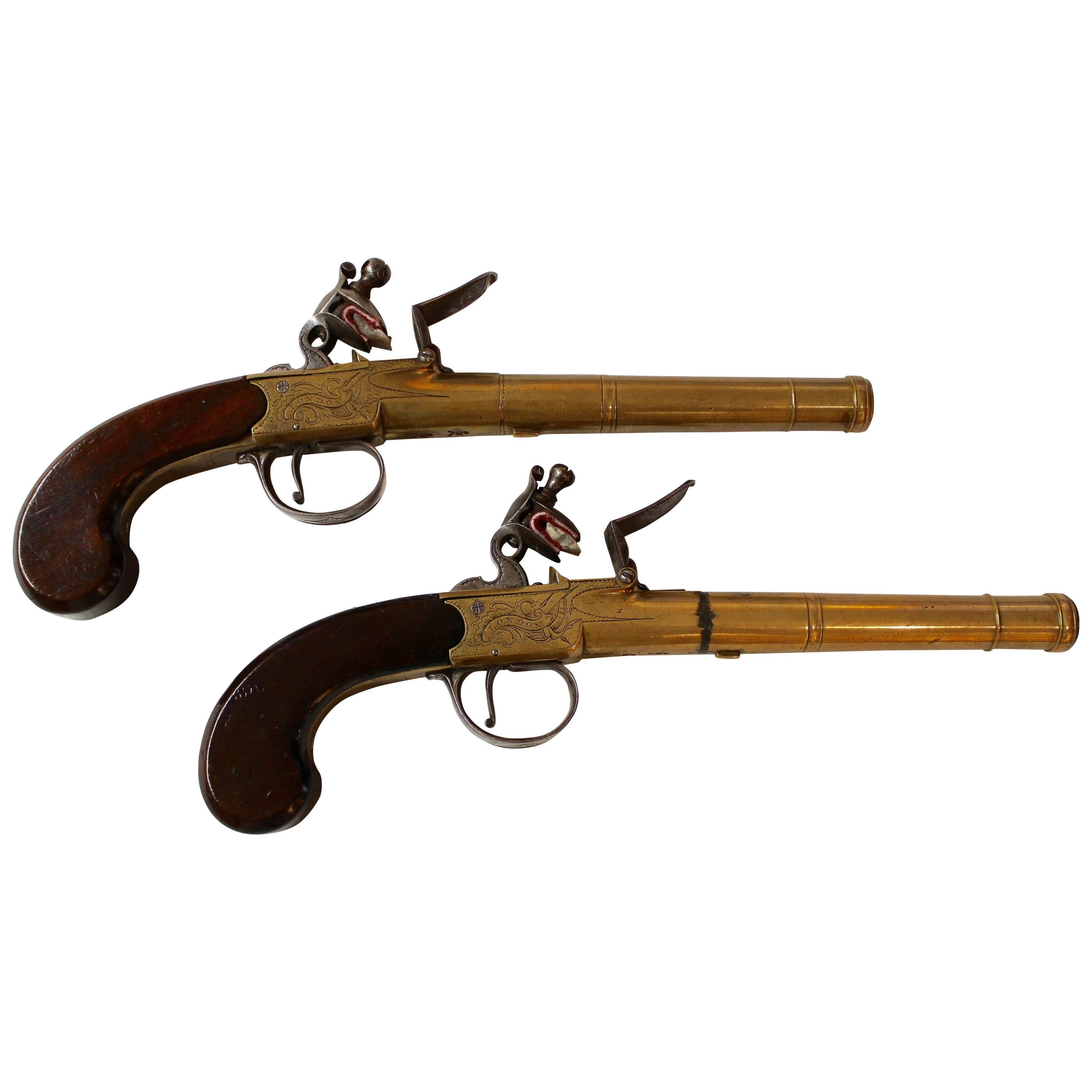 Pair of English Queen Anne Brass Pistols