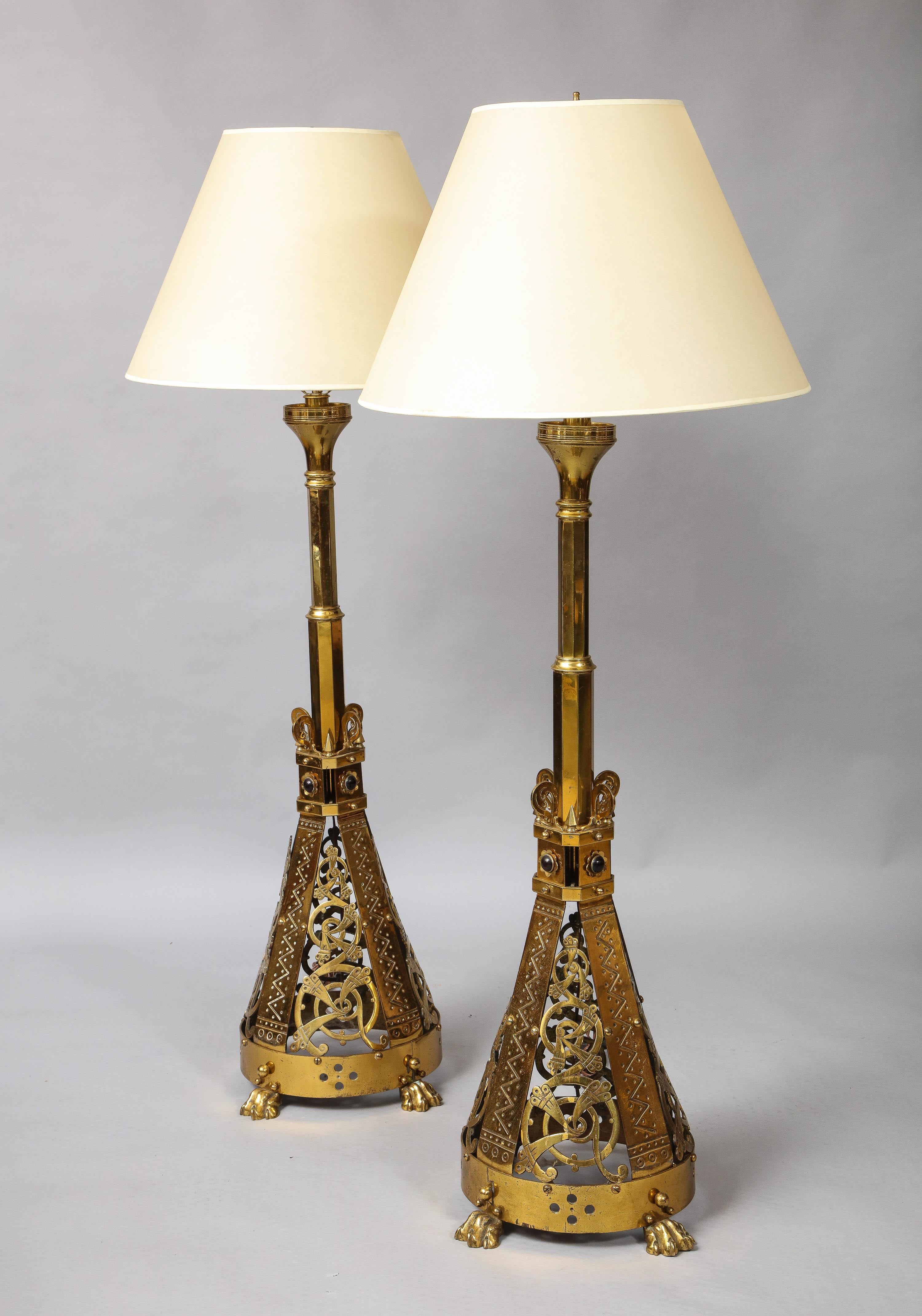 Fine pair of English mid-19th century Gothic Revival brass standard lamps, now electrified.

 