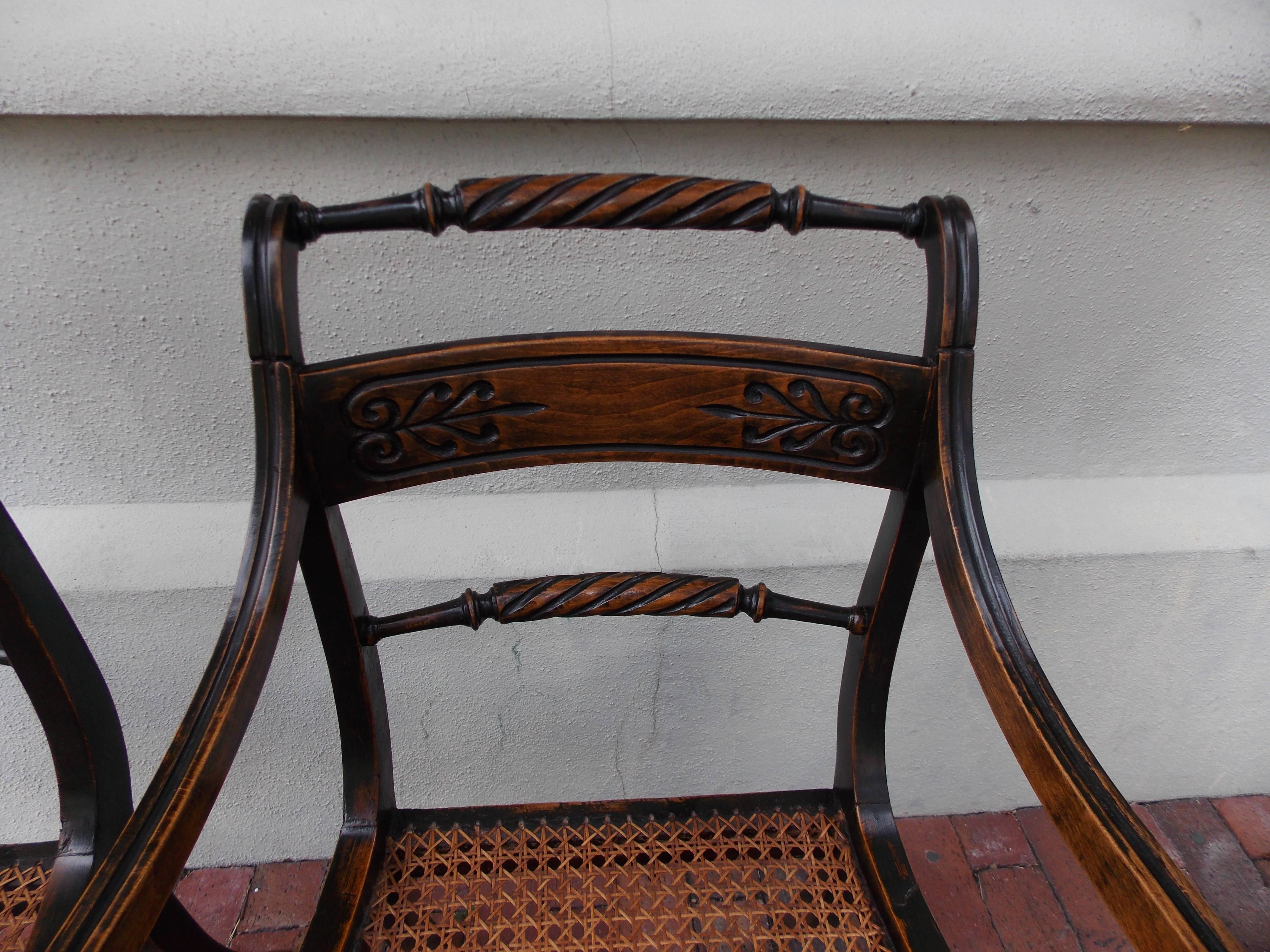 Hand-Carved Pair of English Regency Black Lacquered and Cane Seat Armchairs, Circa 1815 For Sale