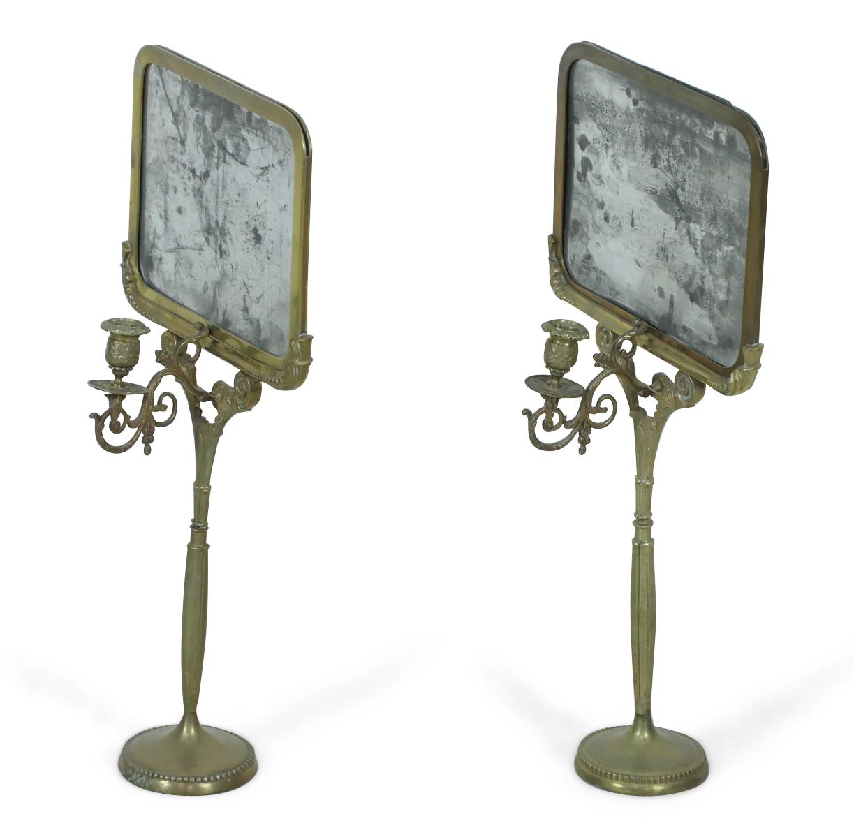 Pair of English Regency-style (19th century) bronze reflector candlestick holders with scroll design arm and round beaded base (Priced as pair).
 