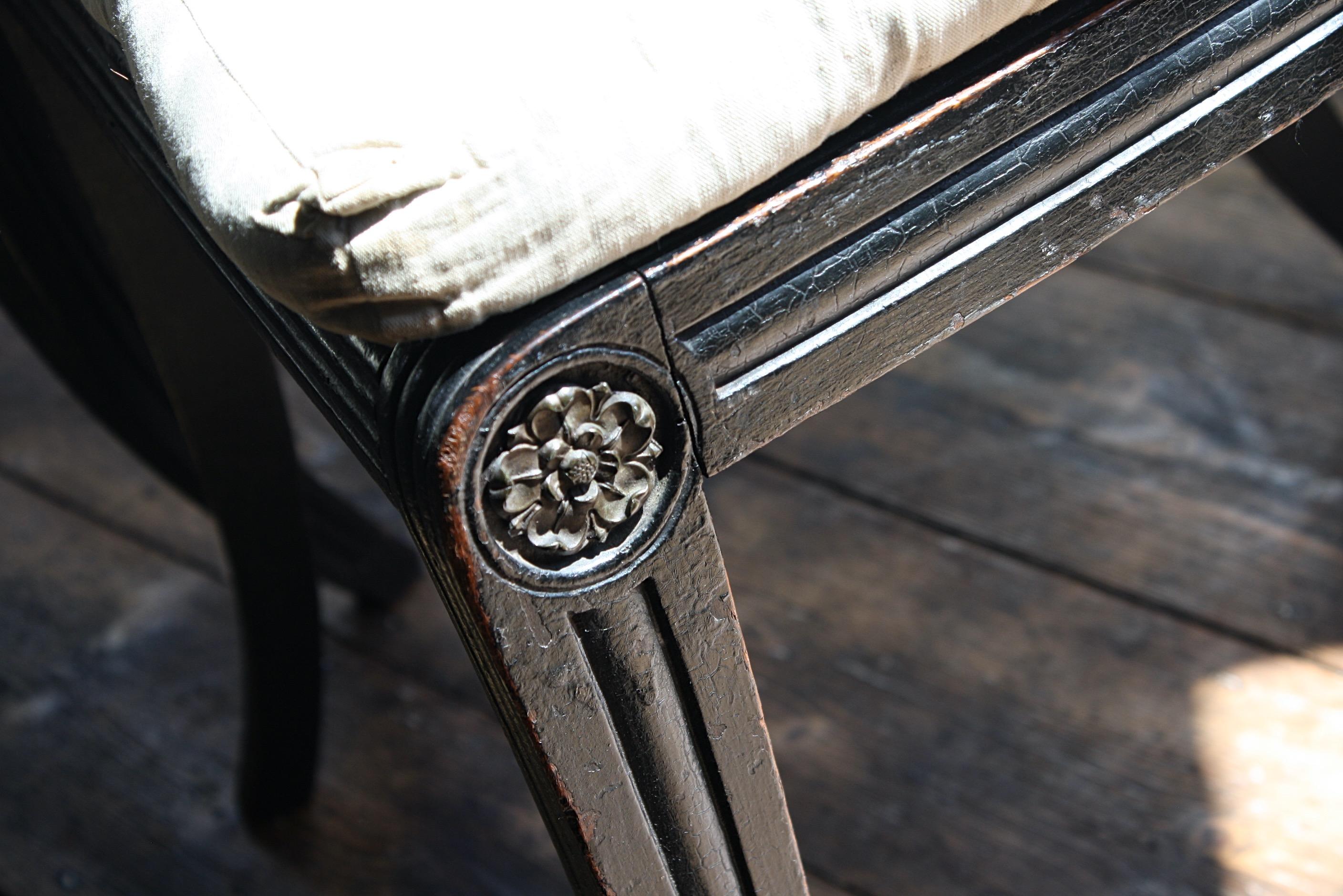 A fine pair of Regency ebonised reeded sabre leg caned chairs, retaining their original squab cushions. Very much in the manner of John Gee

In typical country house condition, the odd minor elderly repair. The chairs are very much in usable