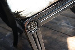 Pair of English Regency Ebonised Caned Klismos Side Chairs with Original Squabs