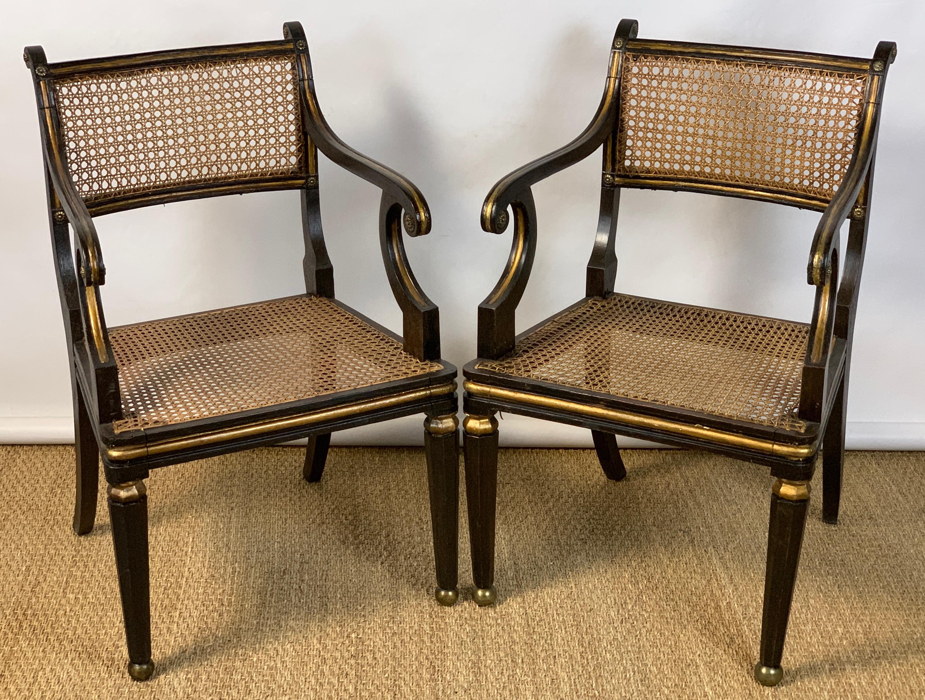 Carved Pair of English Regency Ebonized and Gilded Armchairs