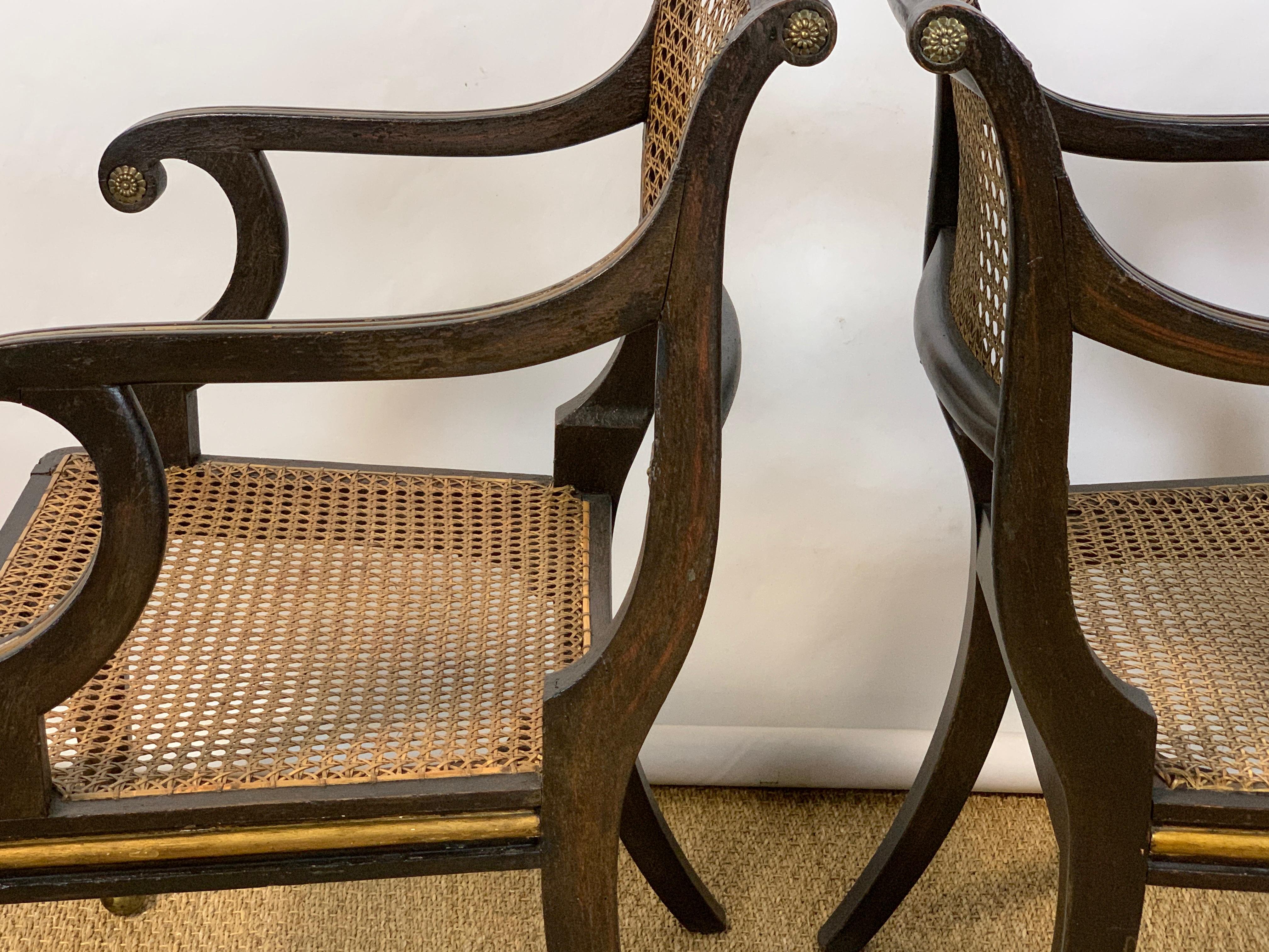 Pair of English Regency Ebonized and Gilded Armchairs 1