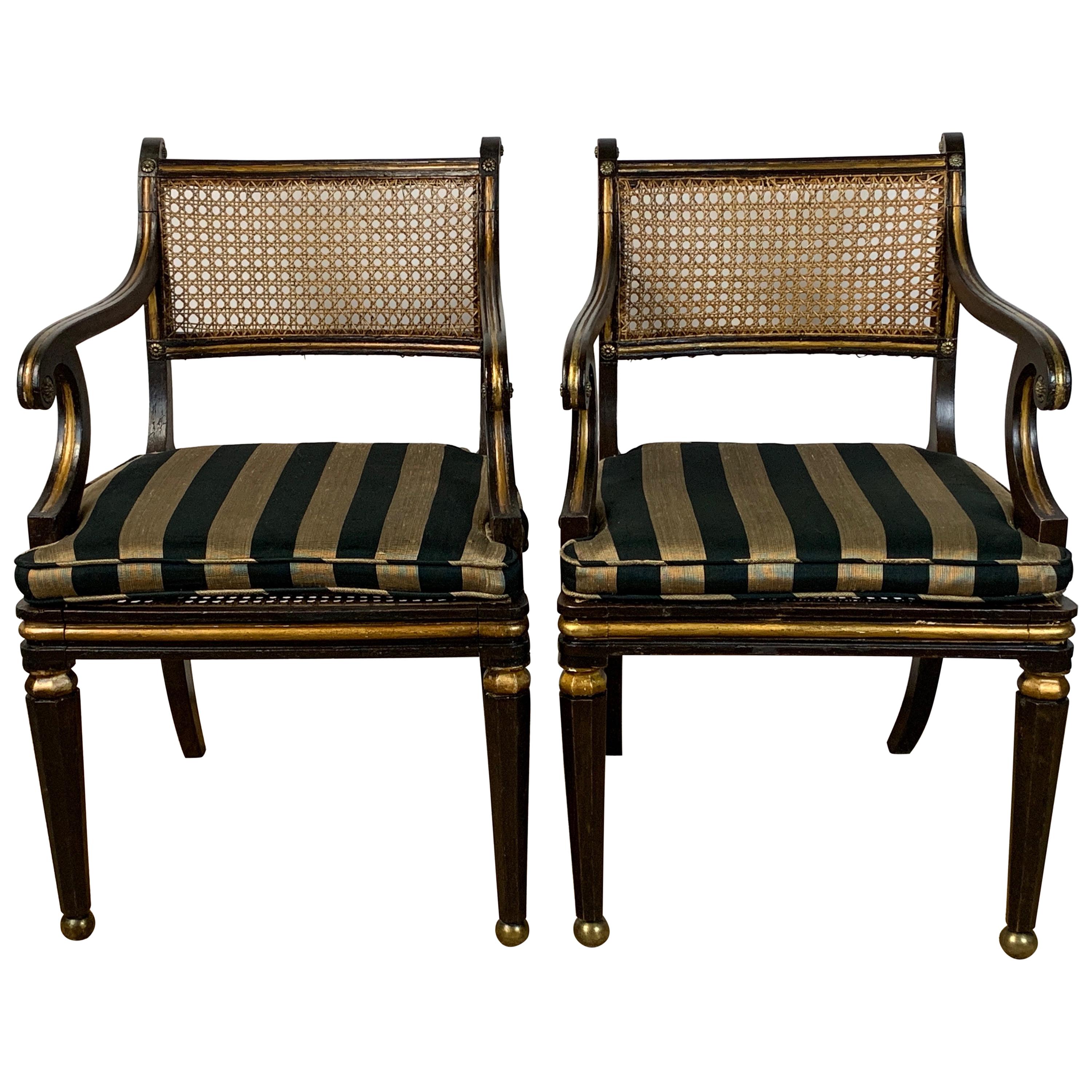 Pair of English Regency Ebonized and Gilded Armchairs