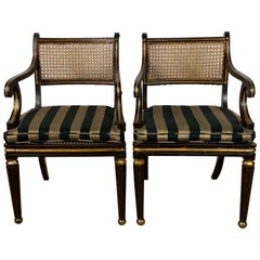 Pair of English Regency Ebonized and Gilded Armchairs