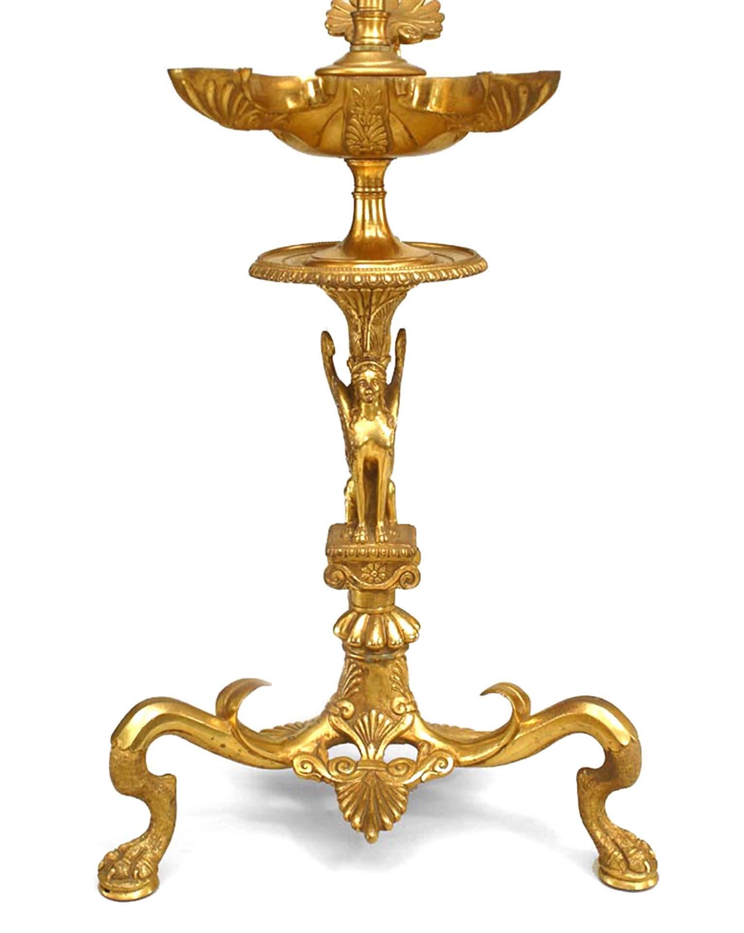 Pair of English Regency style (19th Century) gilt bronze Aladdin style table lamps with sphinx on 3 legs (PRICED AS Pair).
