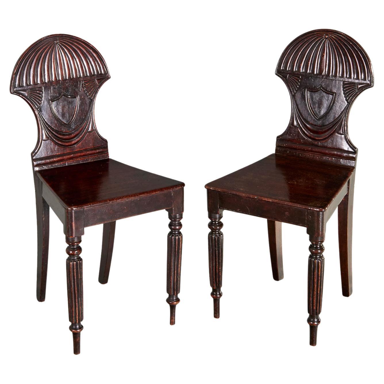 Pair of English Regency Mahogany Hall Chairs For Sale
