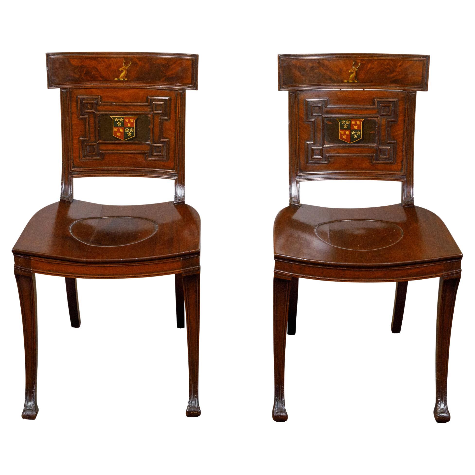 Pair of English Regency Mahogany Hall Chairs with Painted Coat of Arms