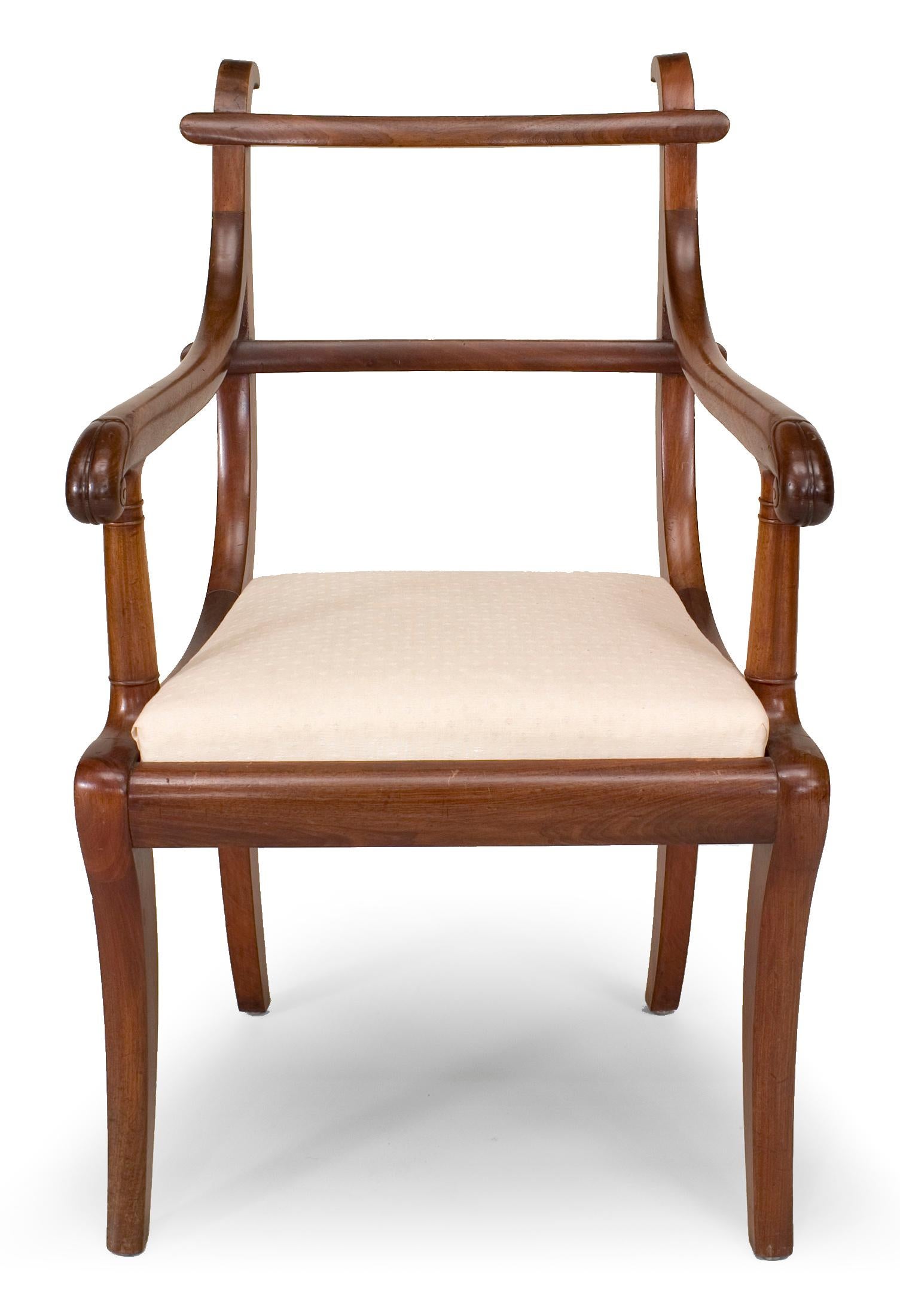 Pair of English Regency style (19th century) provincial mahogany ladder back arm chairs with slip seat.