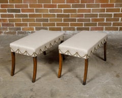 Pair of English Regency Mahogany Stools with Saber Legs and Custom Upholstery