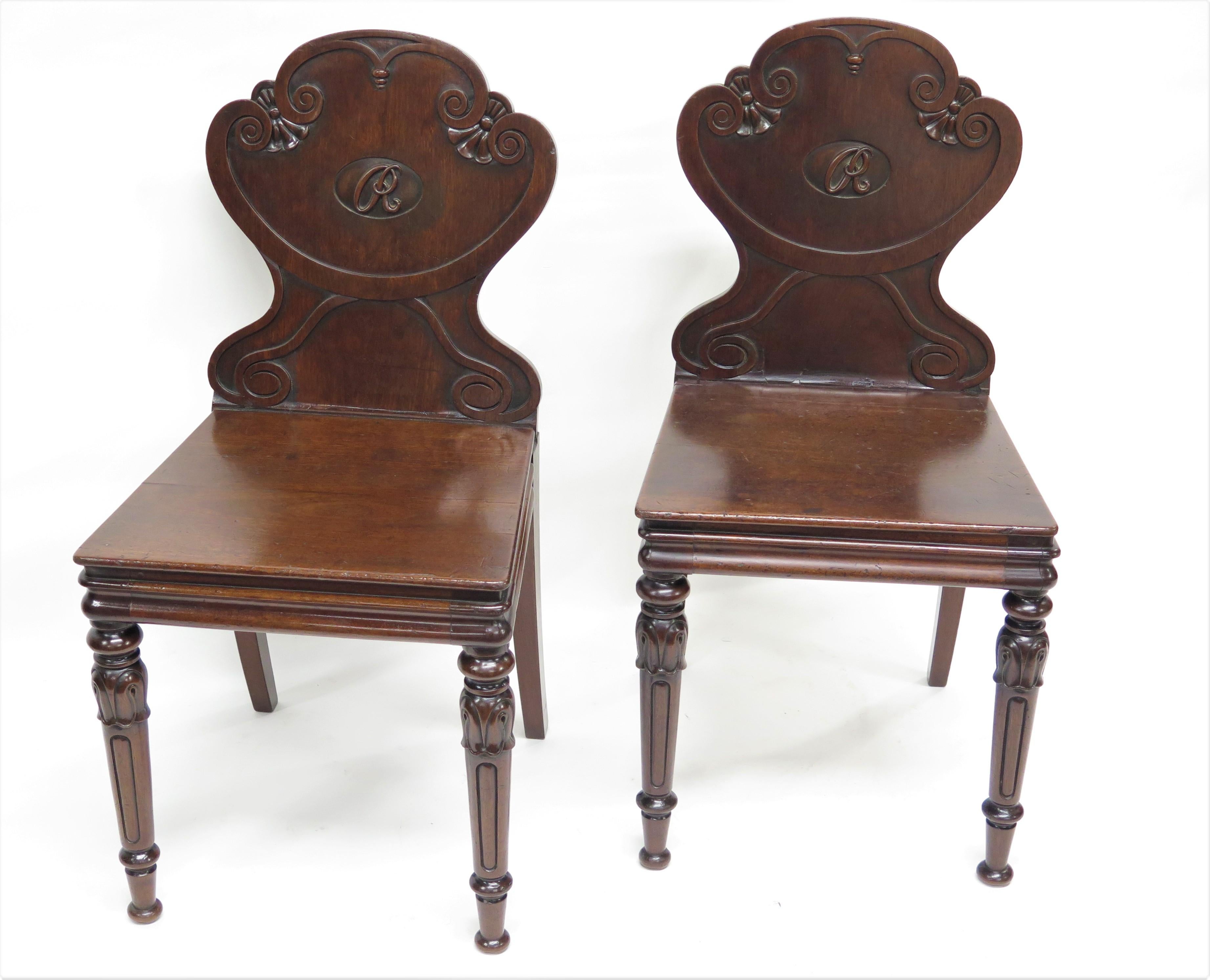a pair of English Regency hall chairs in the Manner of Gillows Lancaster and London, with an 