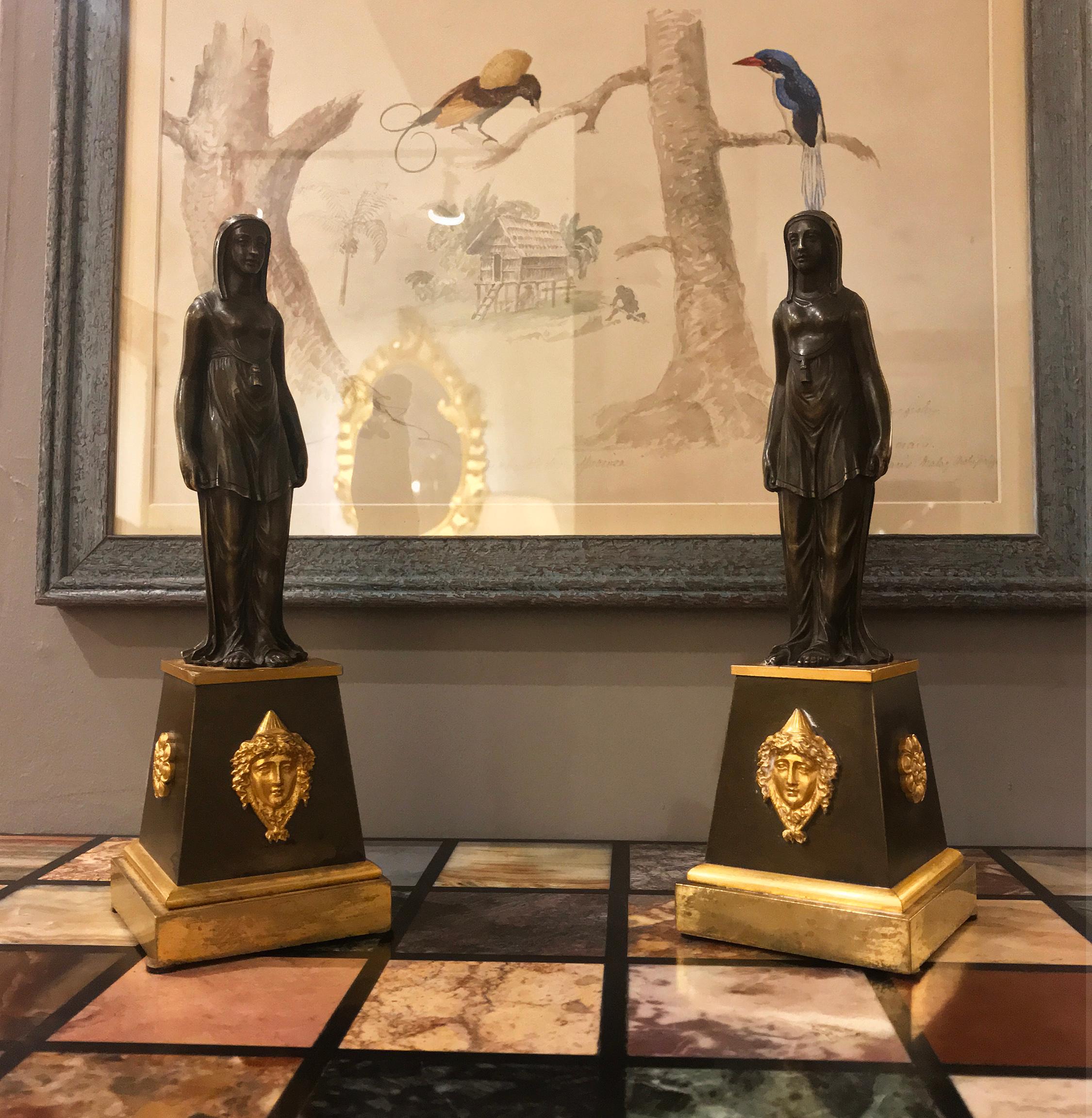 Pair of English Regency neoclassical patinated and gilt bronze figures.