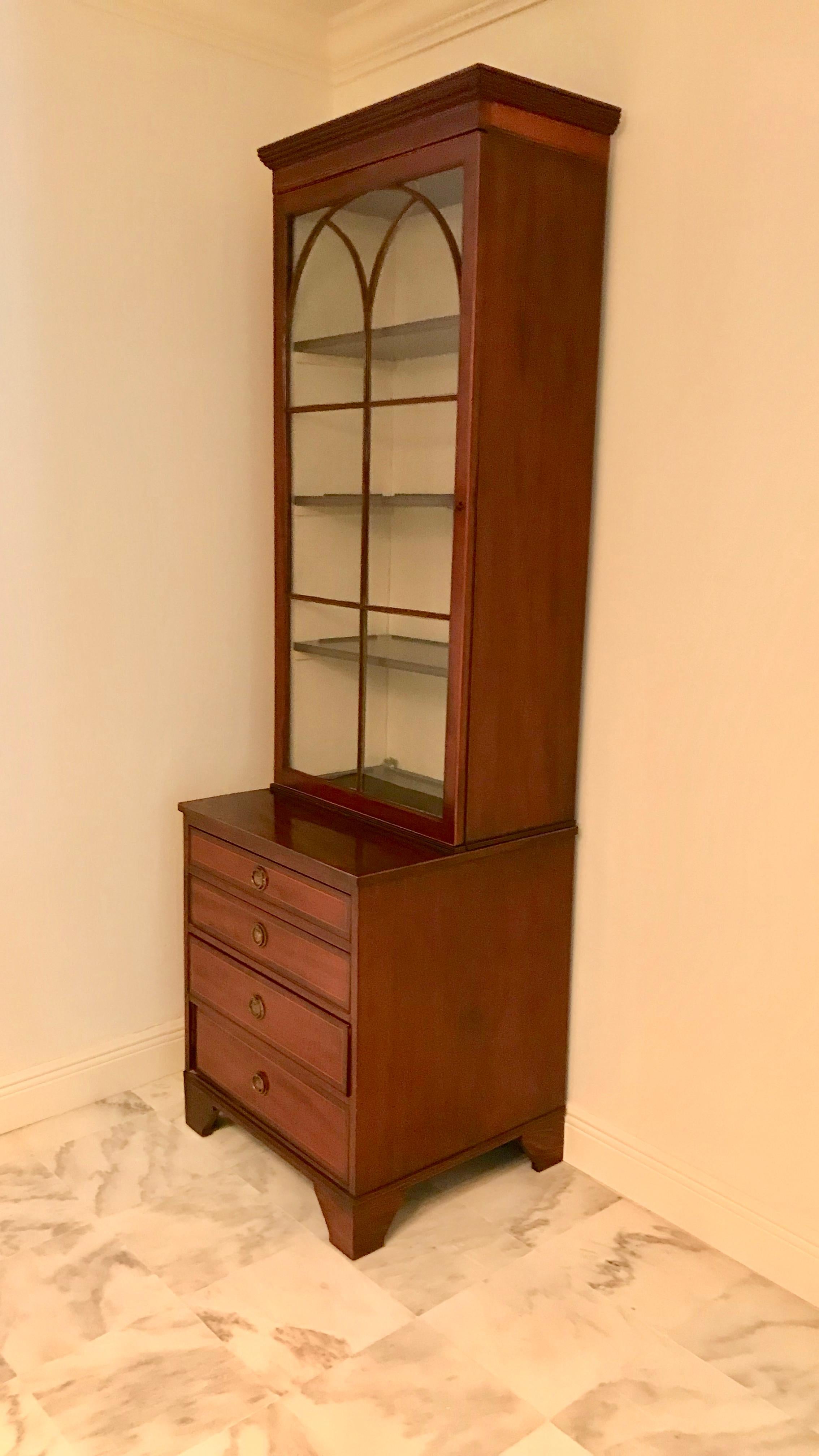 Quality and superb design. The handmade cabinetry is superior.
The cabinets are fashioned with step back tops (which are attached separately
for easy moving). The glass is set individually. Fine details and inlay. Silk lined
interior back and