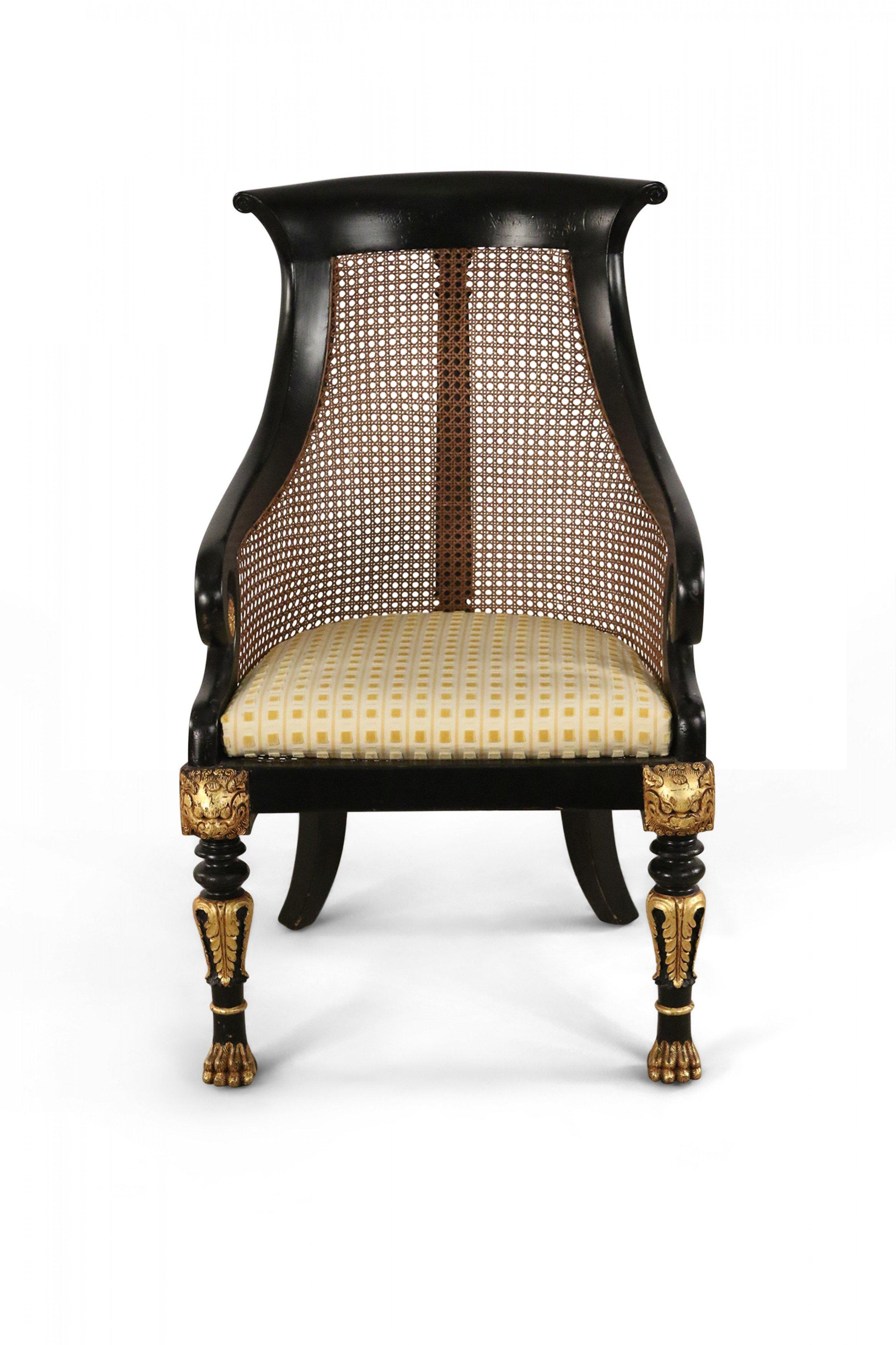 Pair of English Regency Style Carved Black and Gilt Cane Back Armchairs In Good Condition For Sale In New York, NY